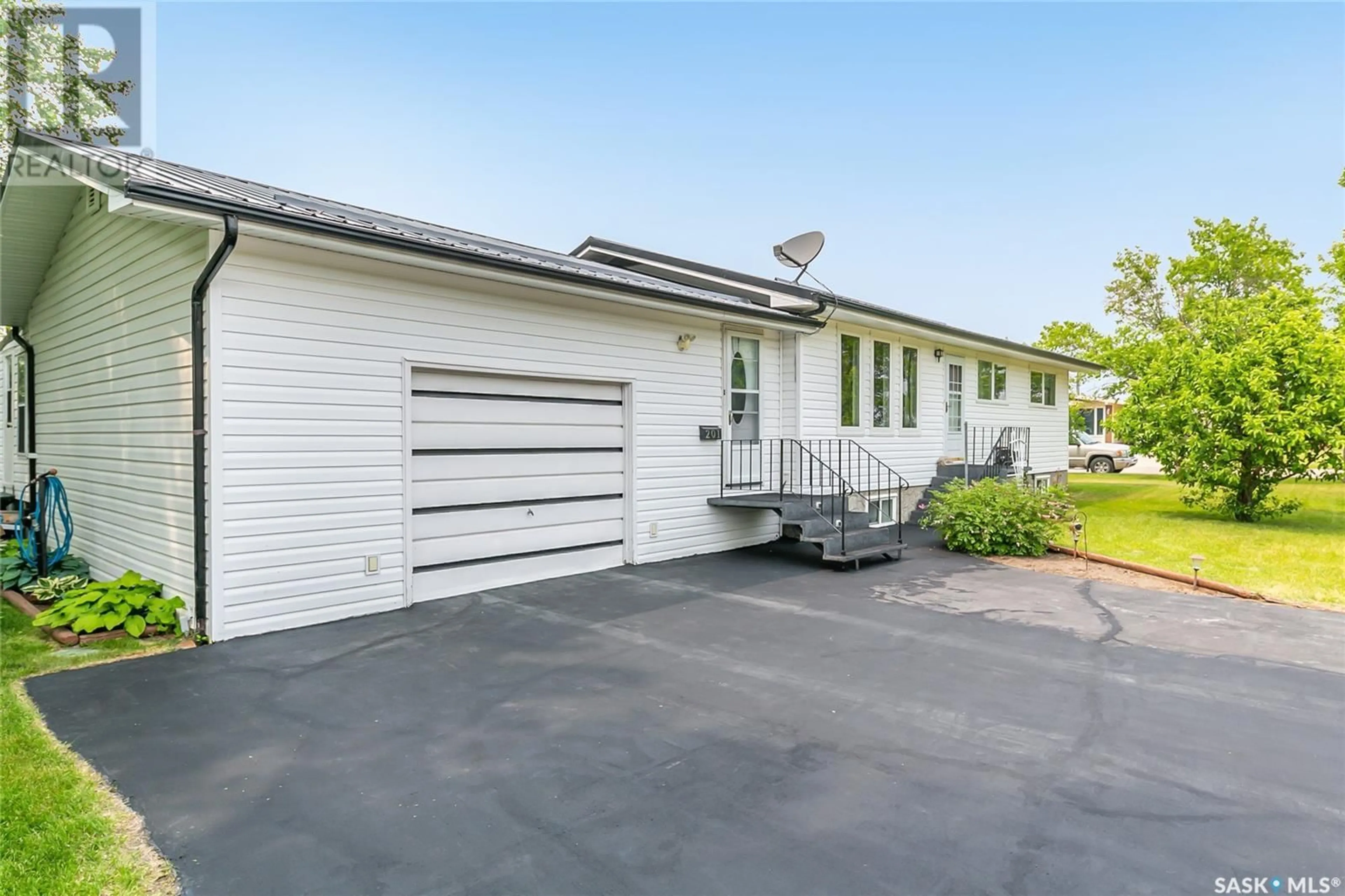 Home with vinyl exterior material, street for 201 CHAPIN STREET, Strasbourg Saskatchewan S0G4V0