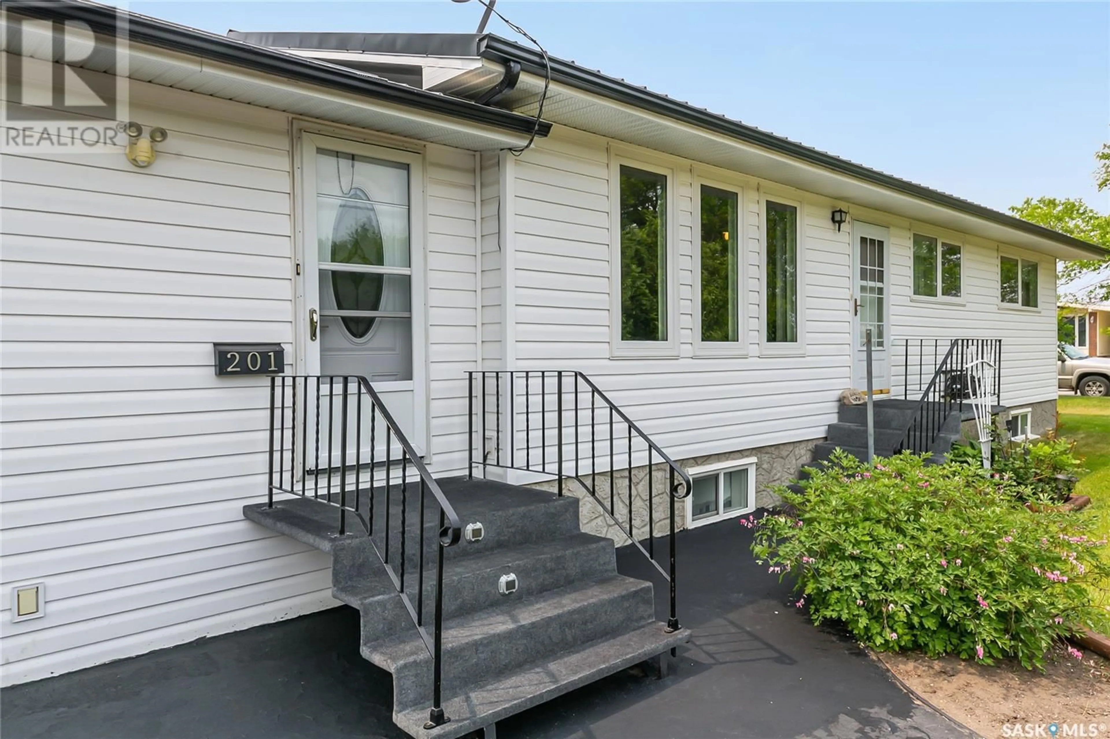 Home with vinyl exterior material, street for 201 CHAPIN STREET, Strasbourg Saskatchewan S0G4V0