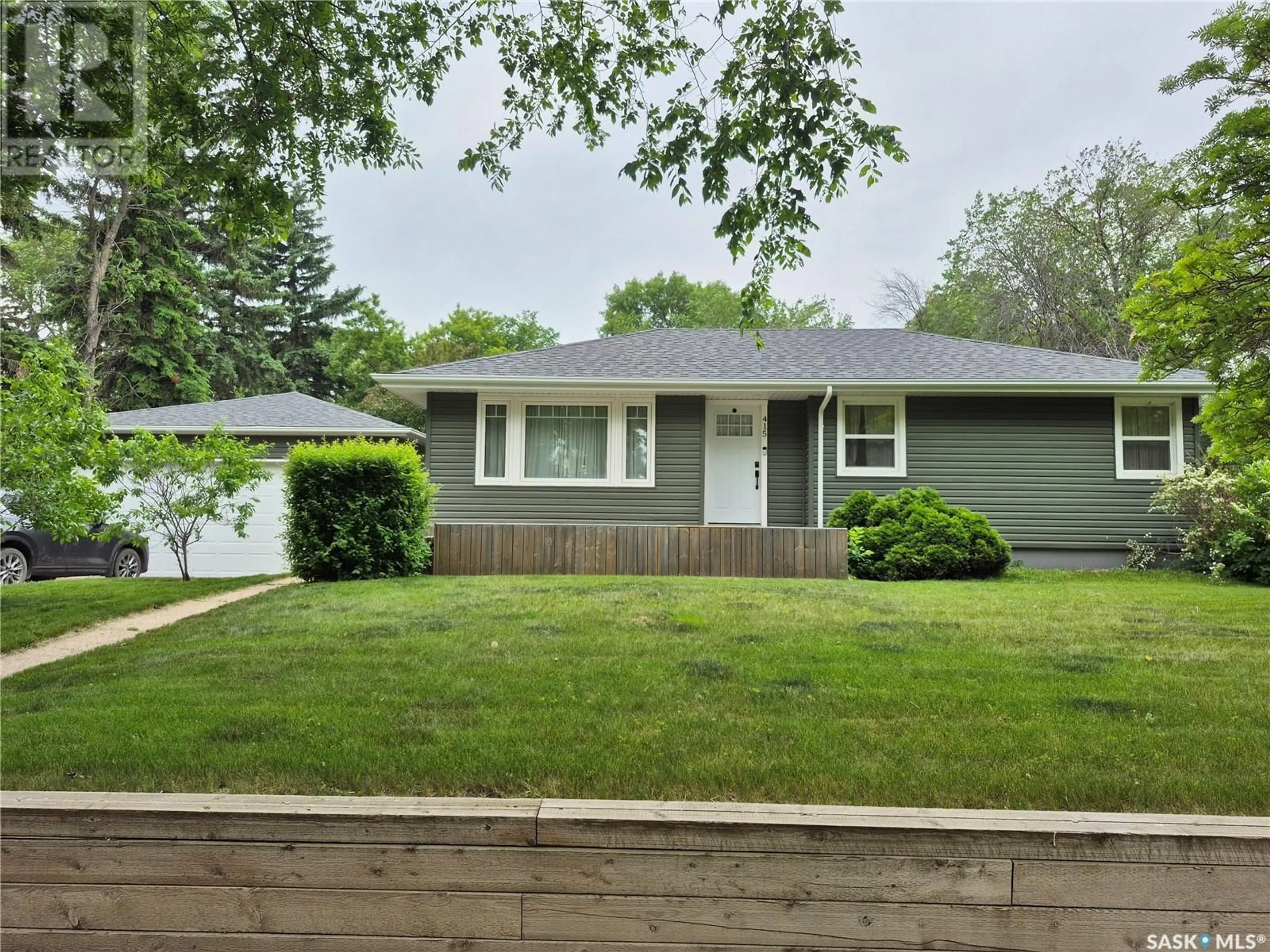 Home with vinyl exterior material, street for 415 4TH STREET, Weyburn Saskatchewan S4H0Y8