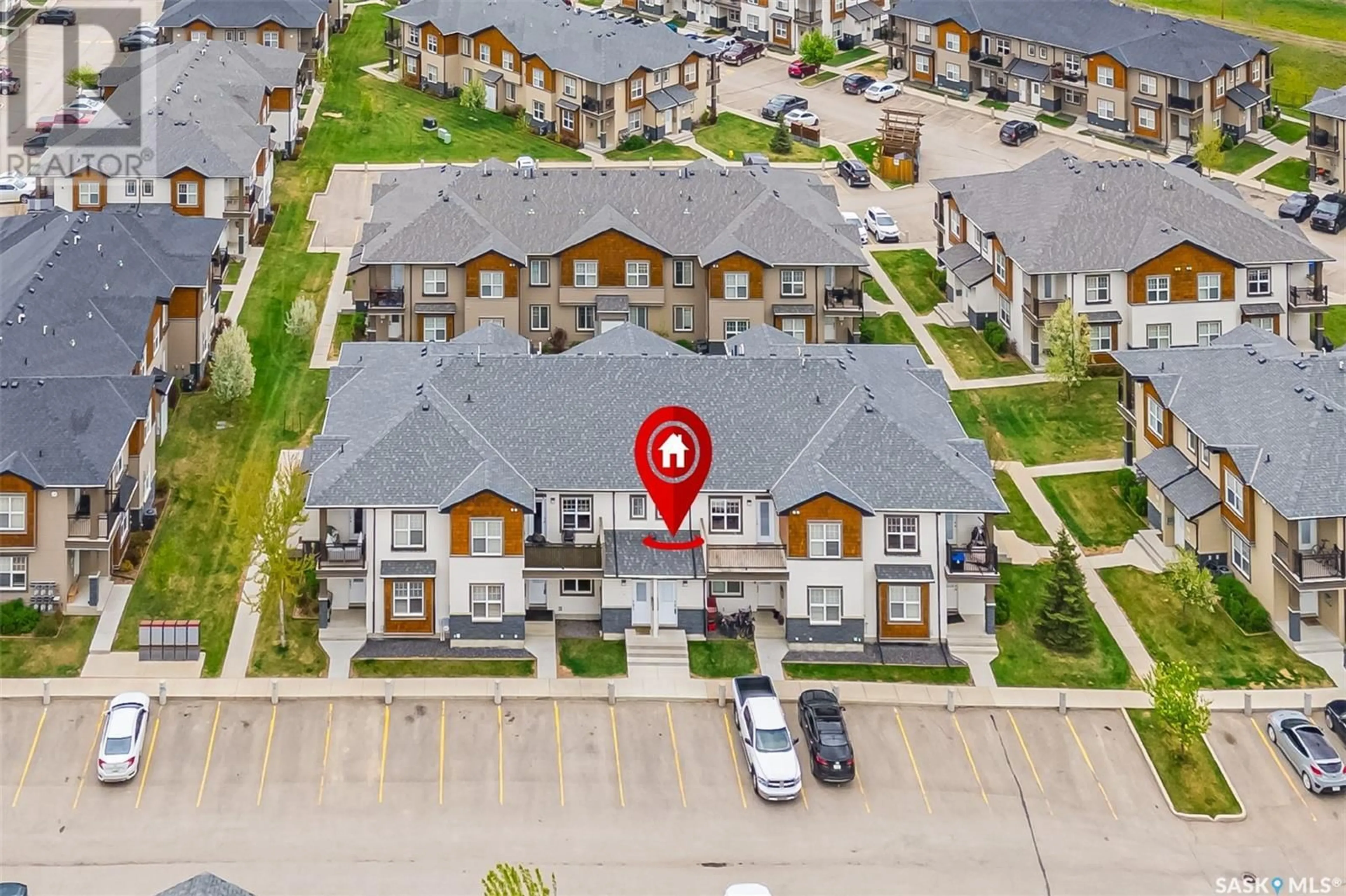 A pic from outside/outdoor area/front of a property/back of a property/a pic from drone, street for 106 - 1015 PATRICK CRESCENT, Saskatoon Saskatchewan S7W0M2