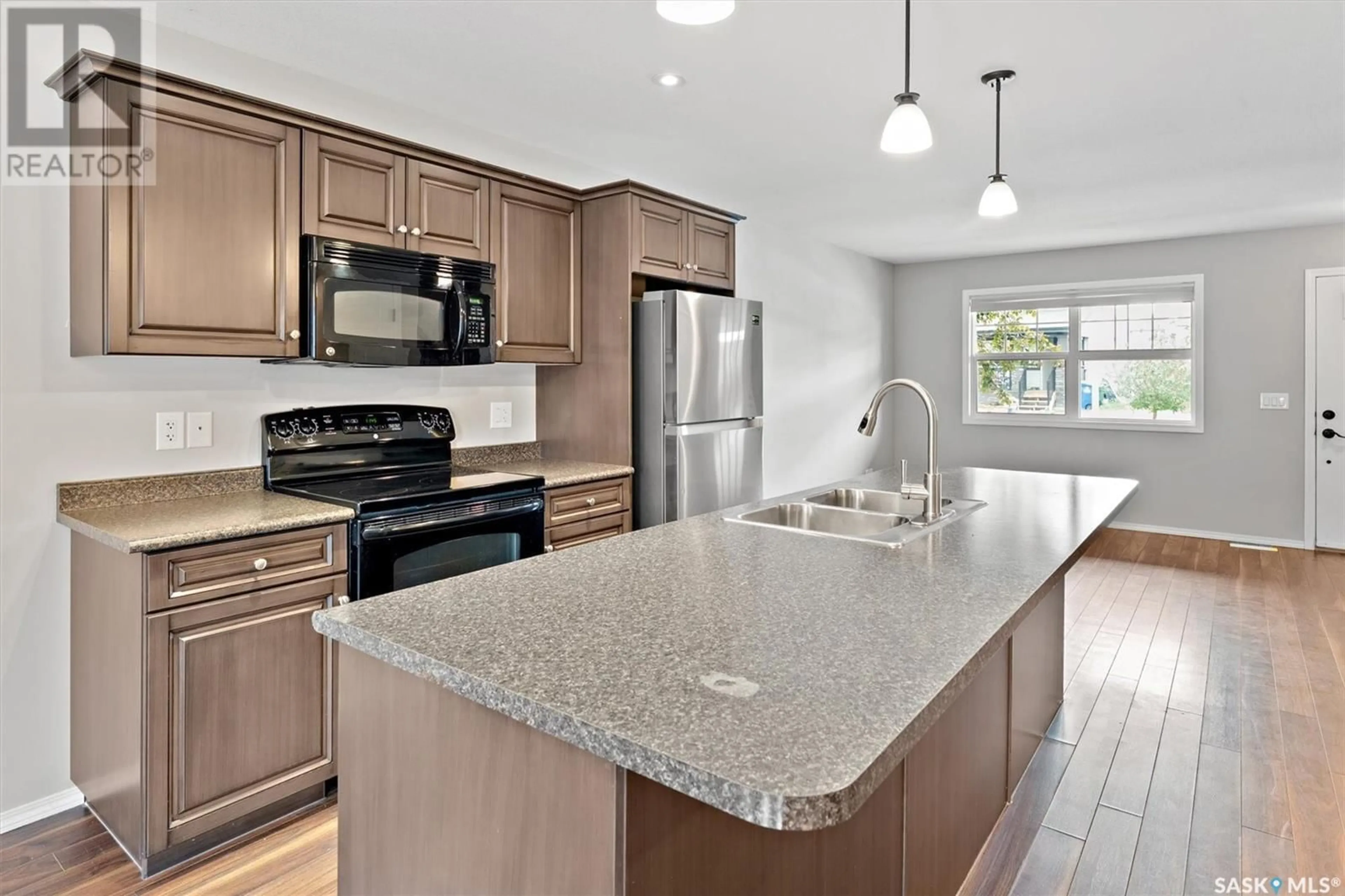 Open concept kitchen, ceramic/tile floor for 212 LANGLOIS WAY, Saskatoon Saskatchewan S7T0L2