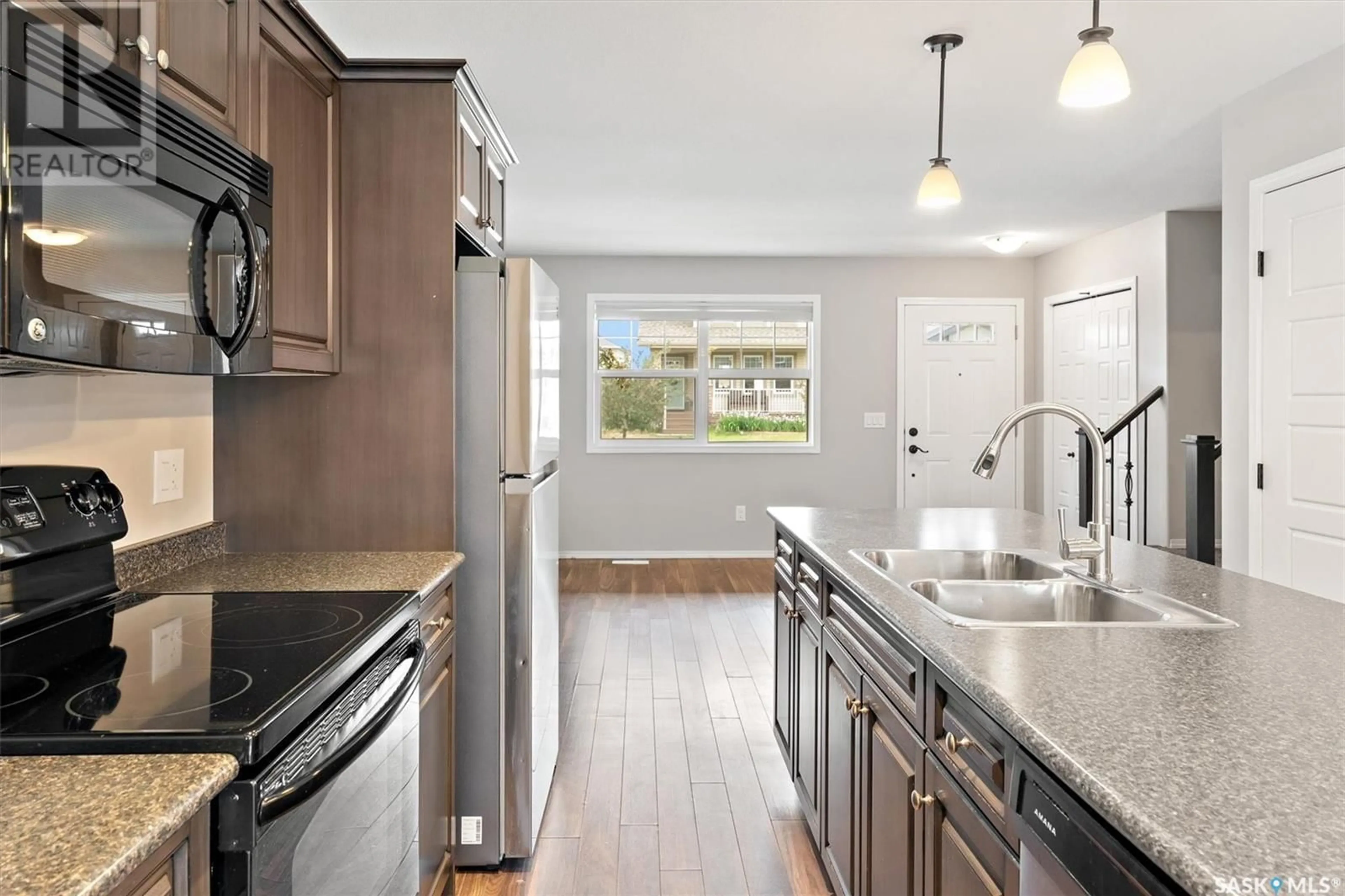 Open concept kitchen, ceramic/tile floor for 212 LANGLOIS WAY, Saskatoon Saskatchewan S7T0L2