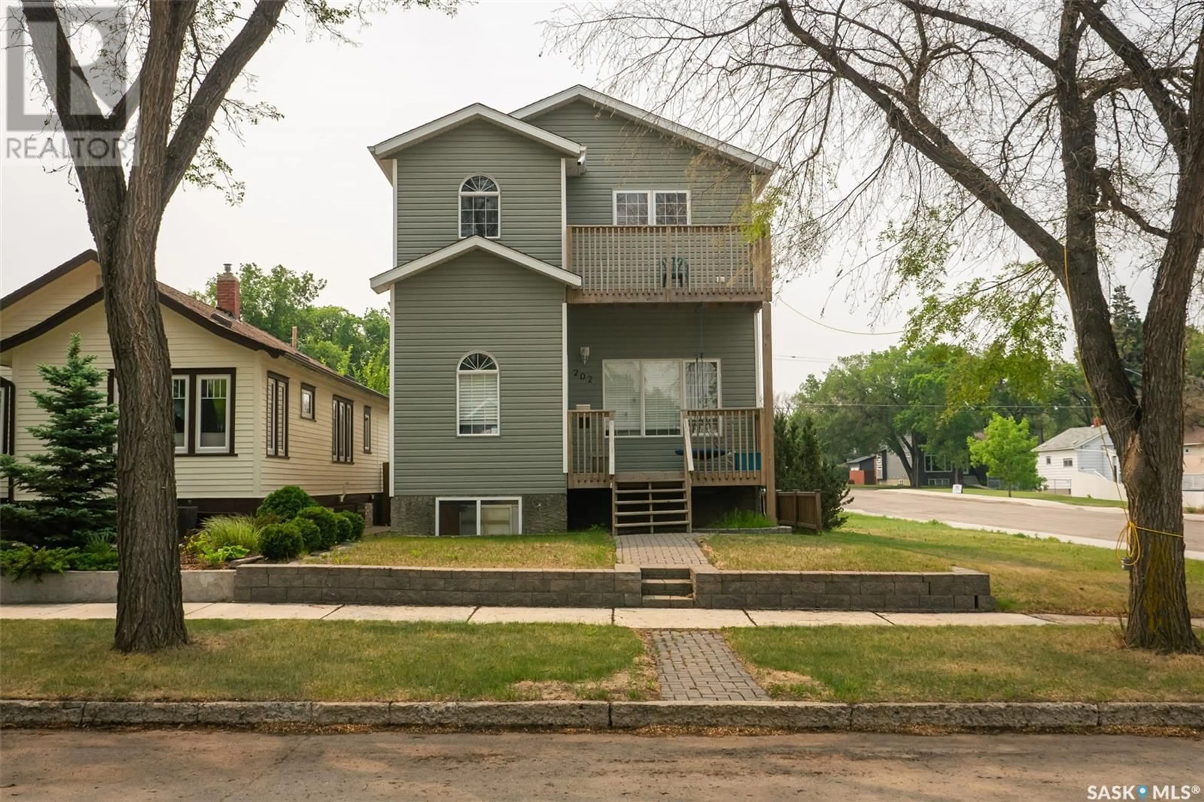 Home with vinyl exterior material, street for 202 2ND STREET, Saskatoon Saskatchewan S7H1N6