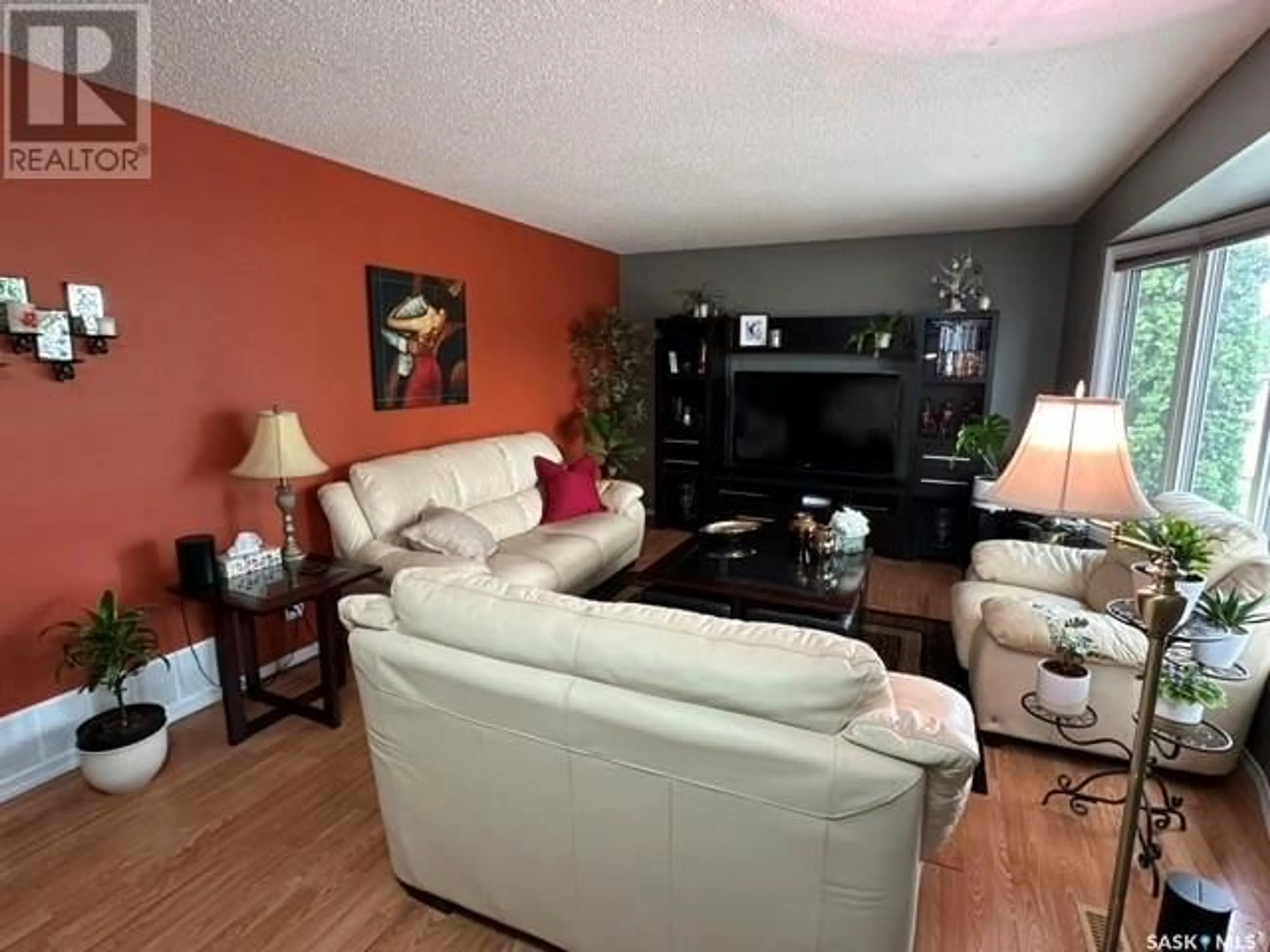 Living room with furniture, wood/laminate floor for 1523 FLEET STREET, Regina Saskatchewan S4N5R8