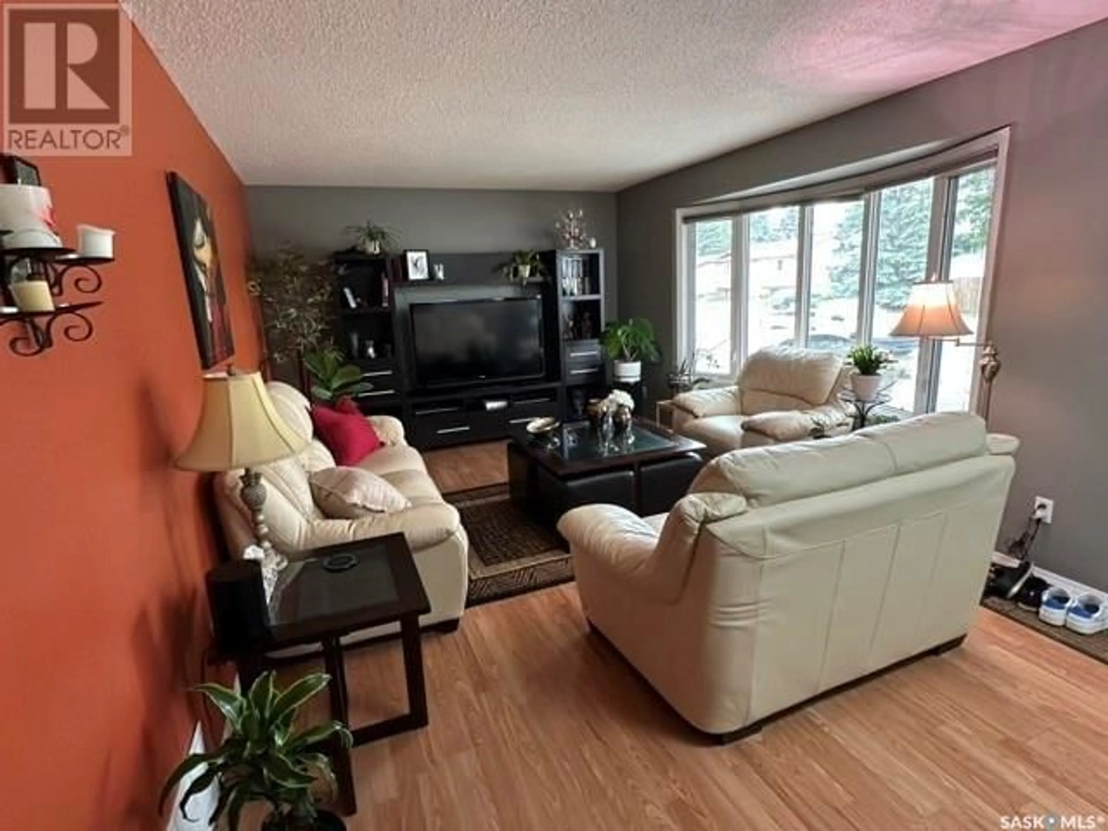 Living room with furniture, wood/laminate floor for 1523 FLEET STREET, Regina Saskatchewan S4N5R8