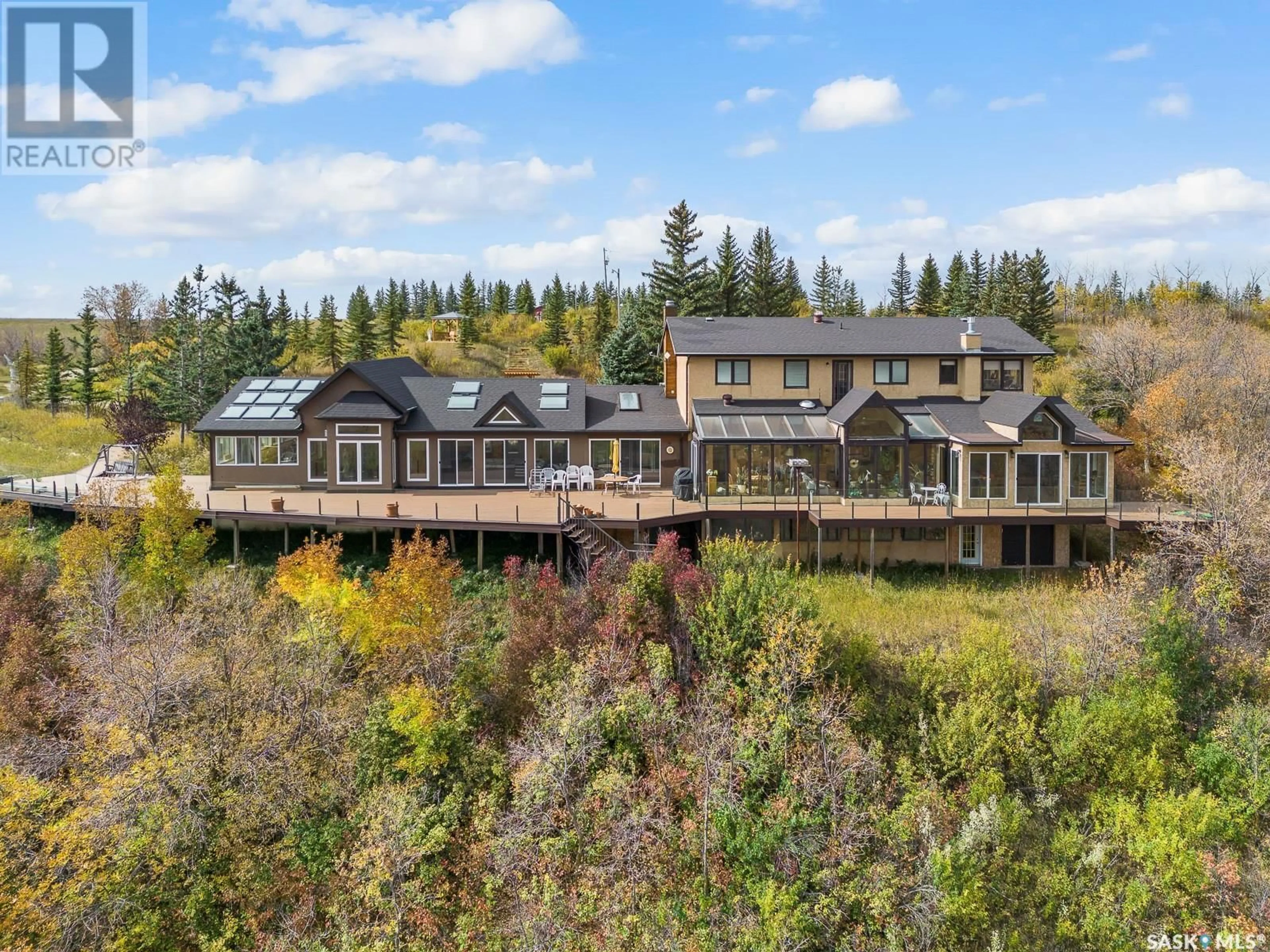 A pic from outside/outdoor area/front of a property/back of a property/a pic from drone, water/lake/river/ocean view for RIPPLINGER ACREAGE, Lumsden Rm No. 189 Saskatchewan S0G0W0
