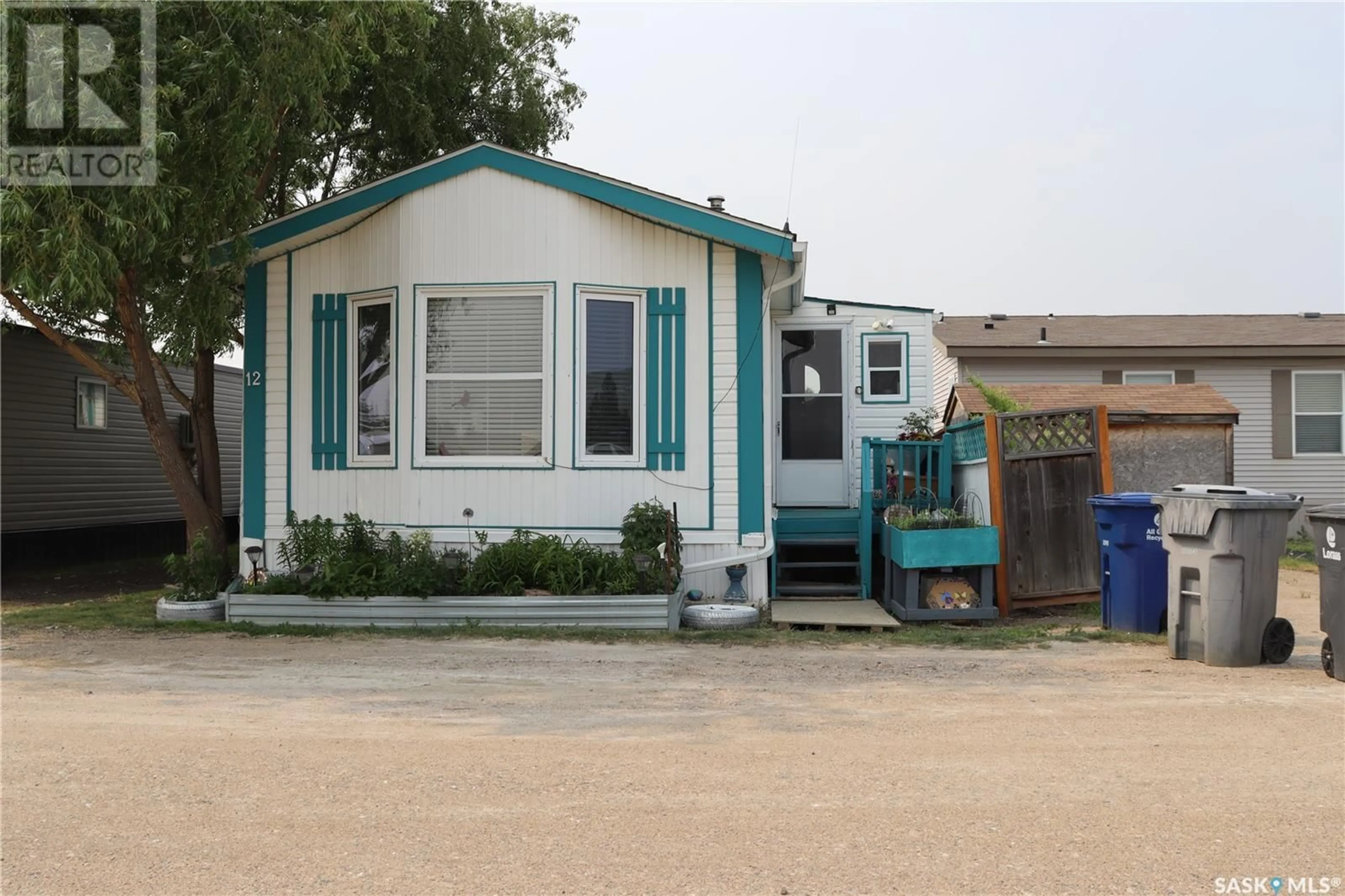 Home with vinyl exterior material, street for E - 12 401 RAILWAY AVENUE, Vanscoy Saskatchewan S0L3J0