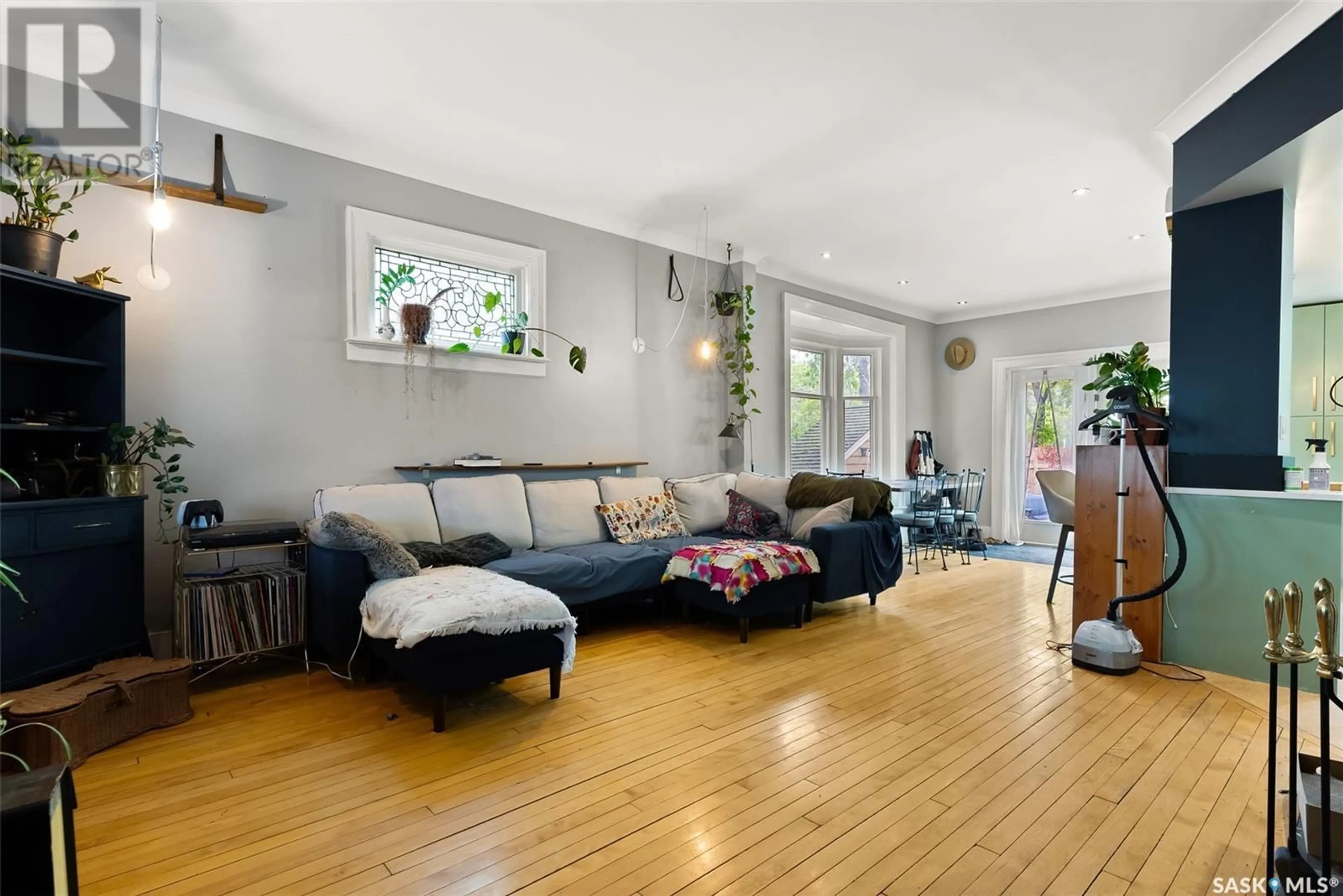 Living room with furniture, wood/laminate floor for 2256 ANGUS STREET, Regina Saskatchewan S4T2A2