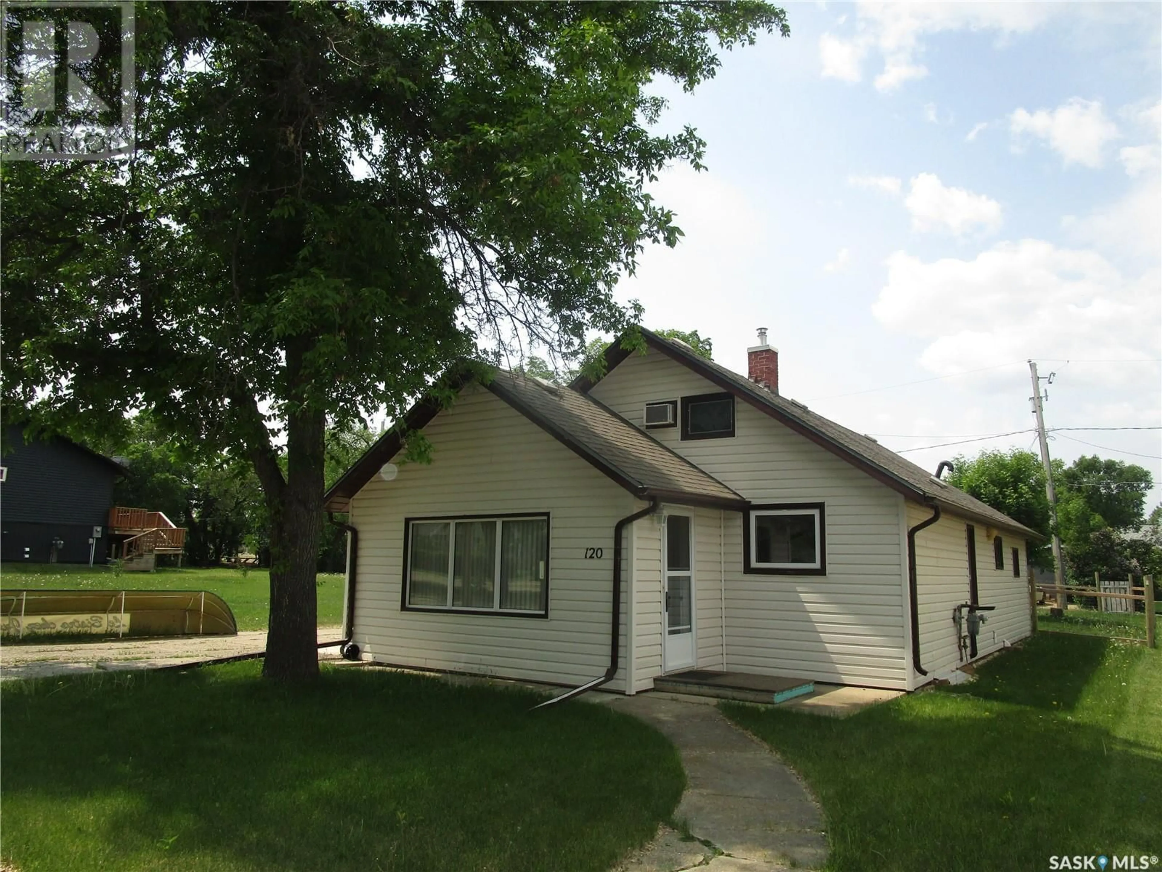 Home with vinyl exterior material, street for 120 2ND STREET, Lafleche Saskatchewan S0H2K0