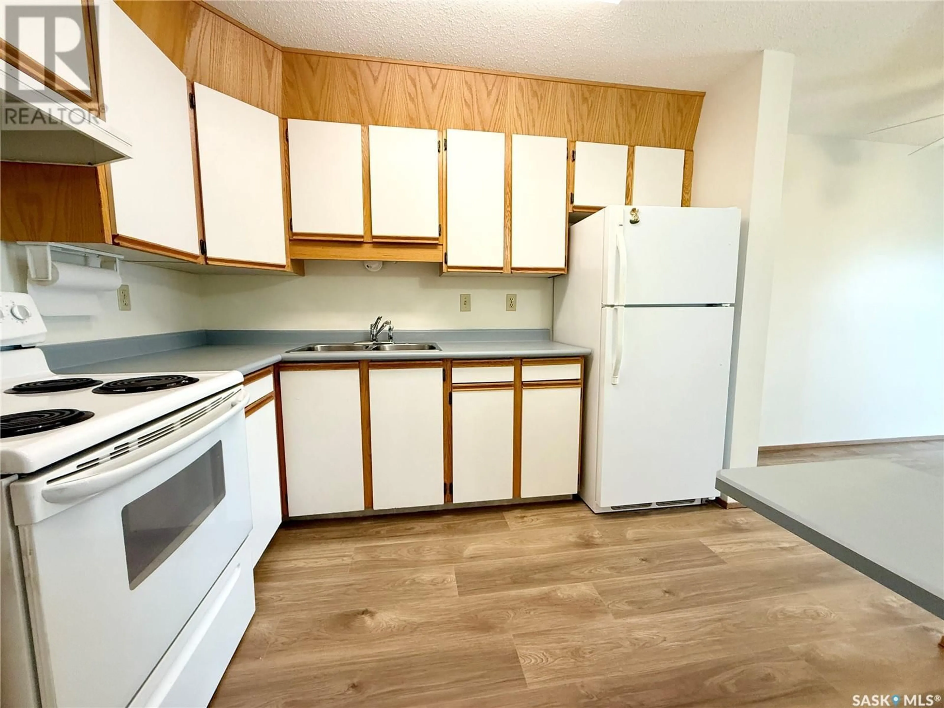 Standard kitchen, wood/laminate floor for 101 - 1002 108TH STREET, North Battleford Saskatchewan S9A2A9