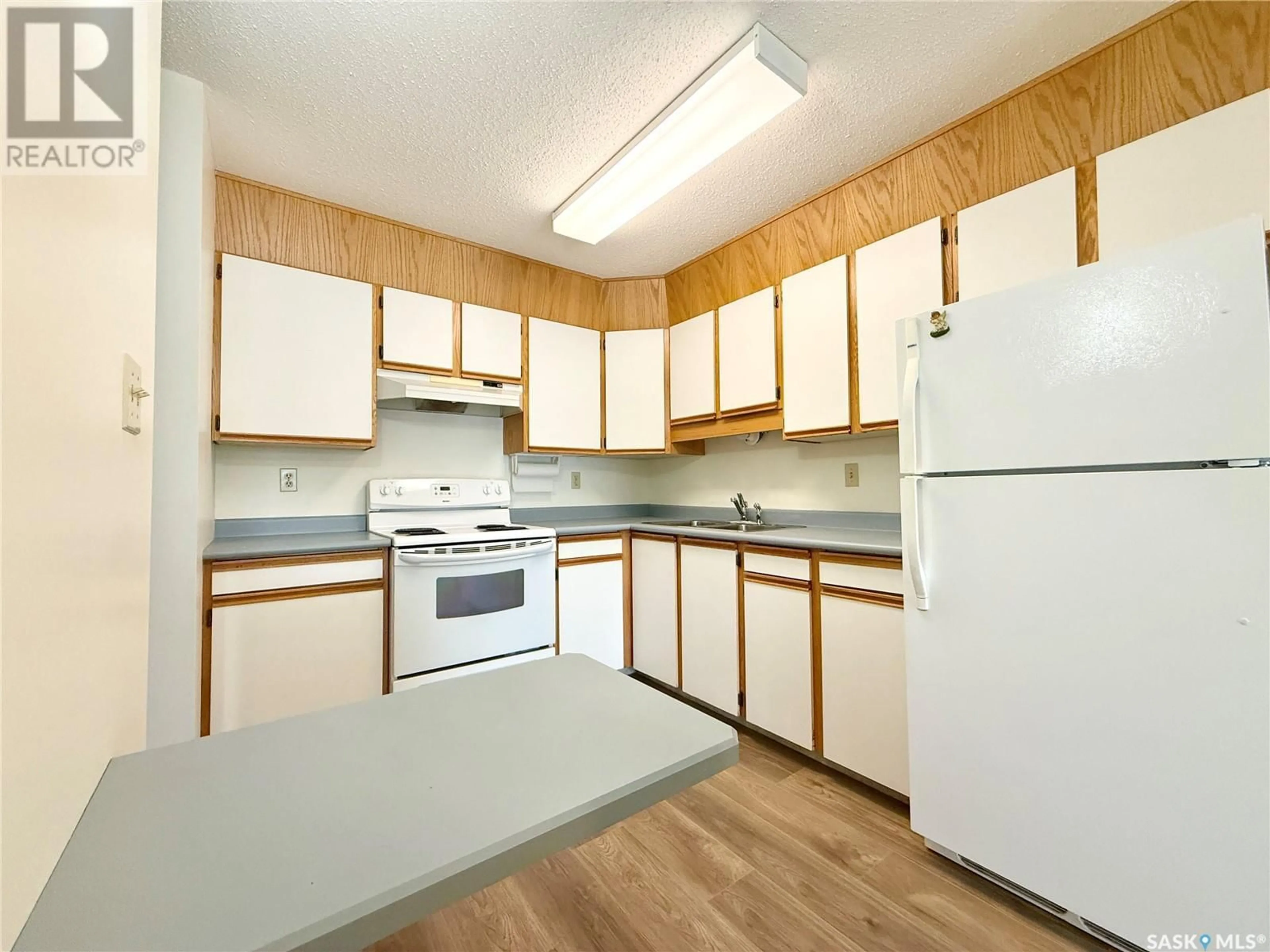 Standard kitchen, wood/laminate floor for 101 - 1002 108TH STREET, North Battleford Saskatchewan S9A2A9