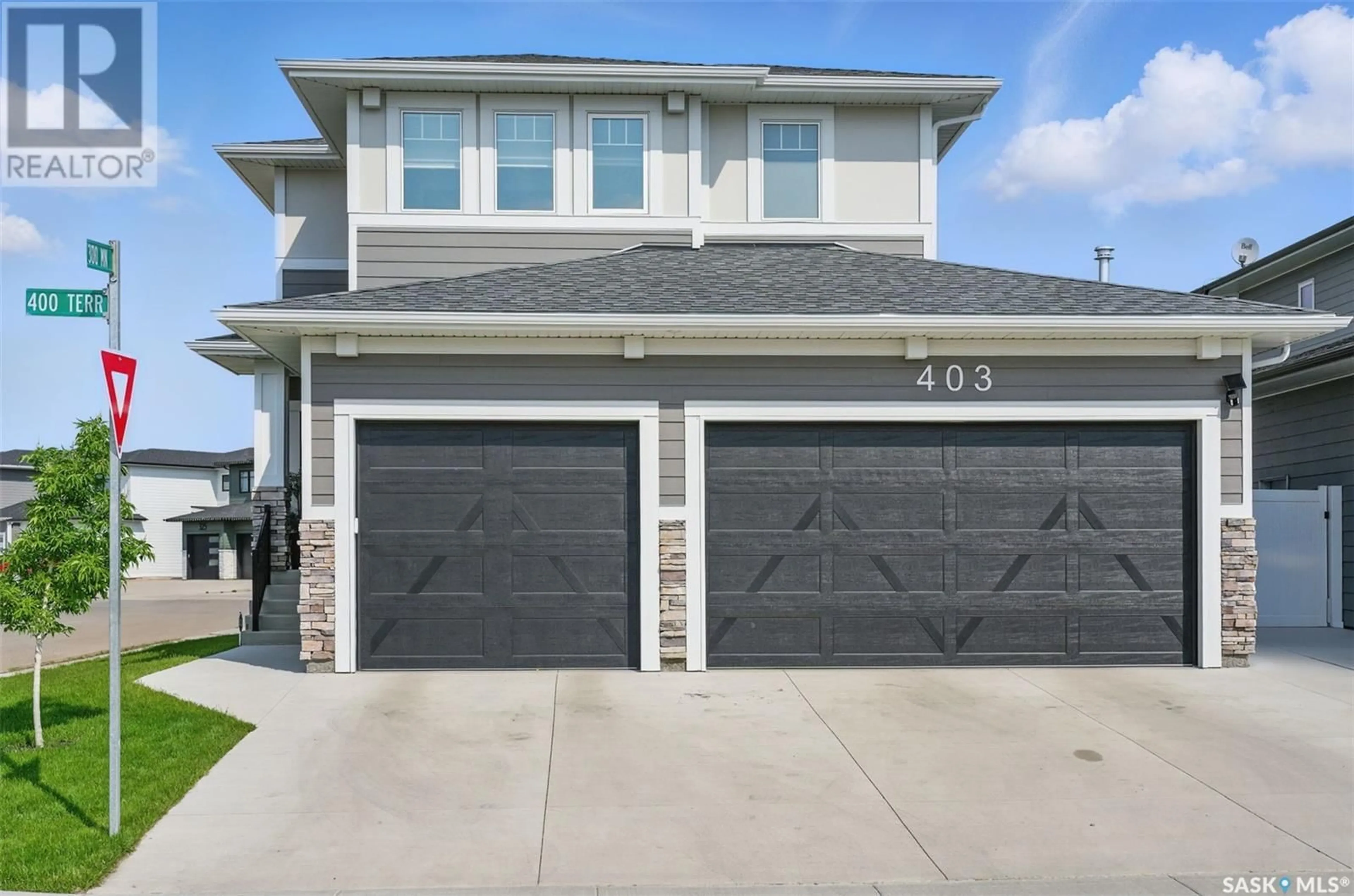 Home with vinyl exterior material, street for 403 DUBOIS TERRACE, Saskatoon Saskatchewan S0K2T0