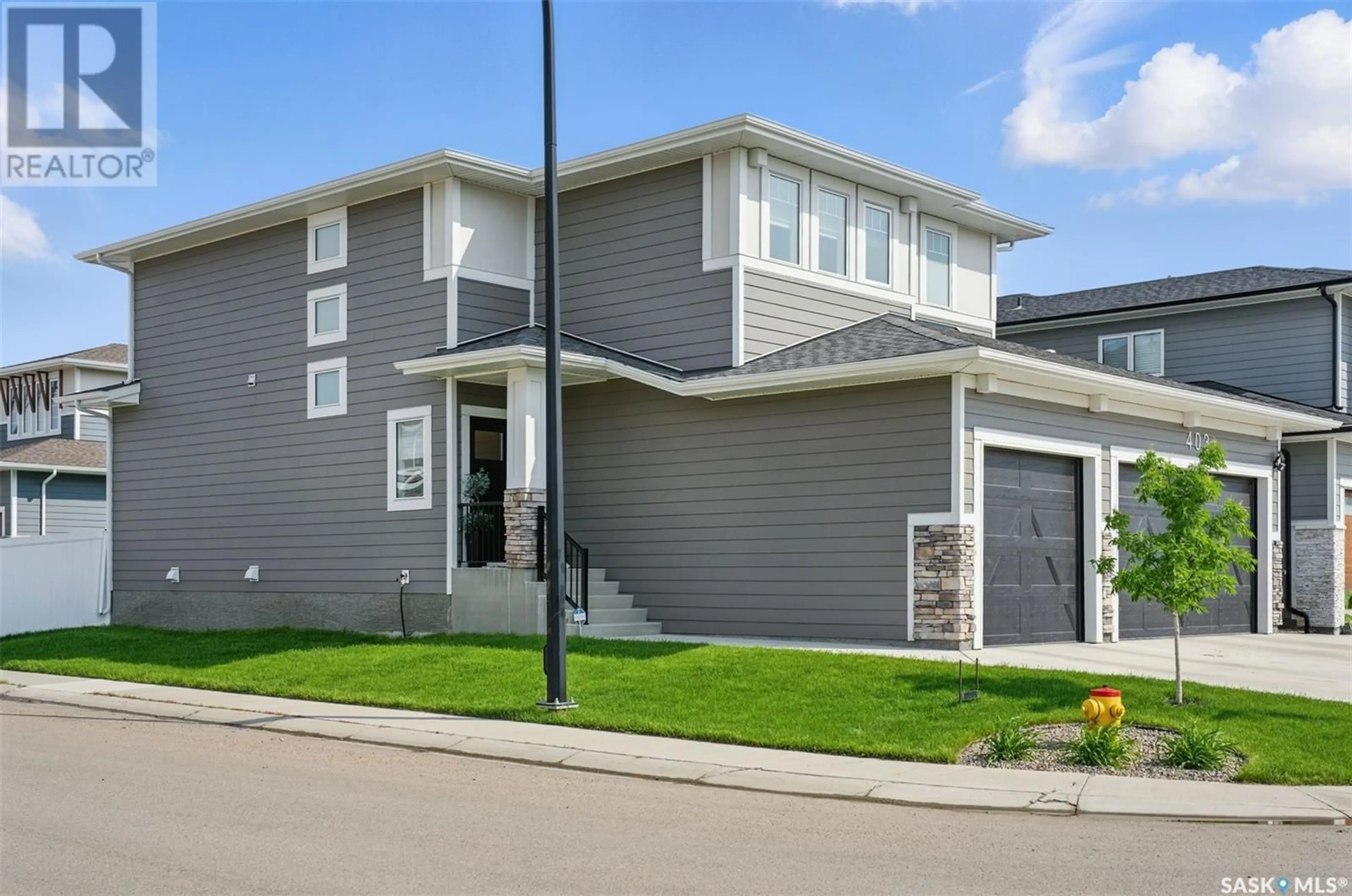 Home with vinyl exterior material, street for 403 DUBOIS TERRACE, Saskatoon Saskatchewan S0K2T0