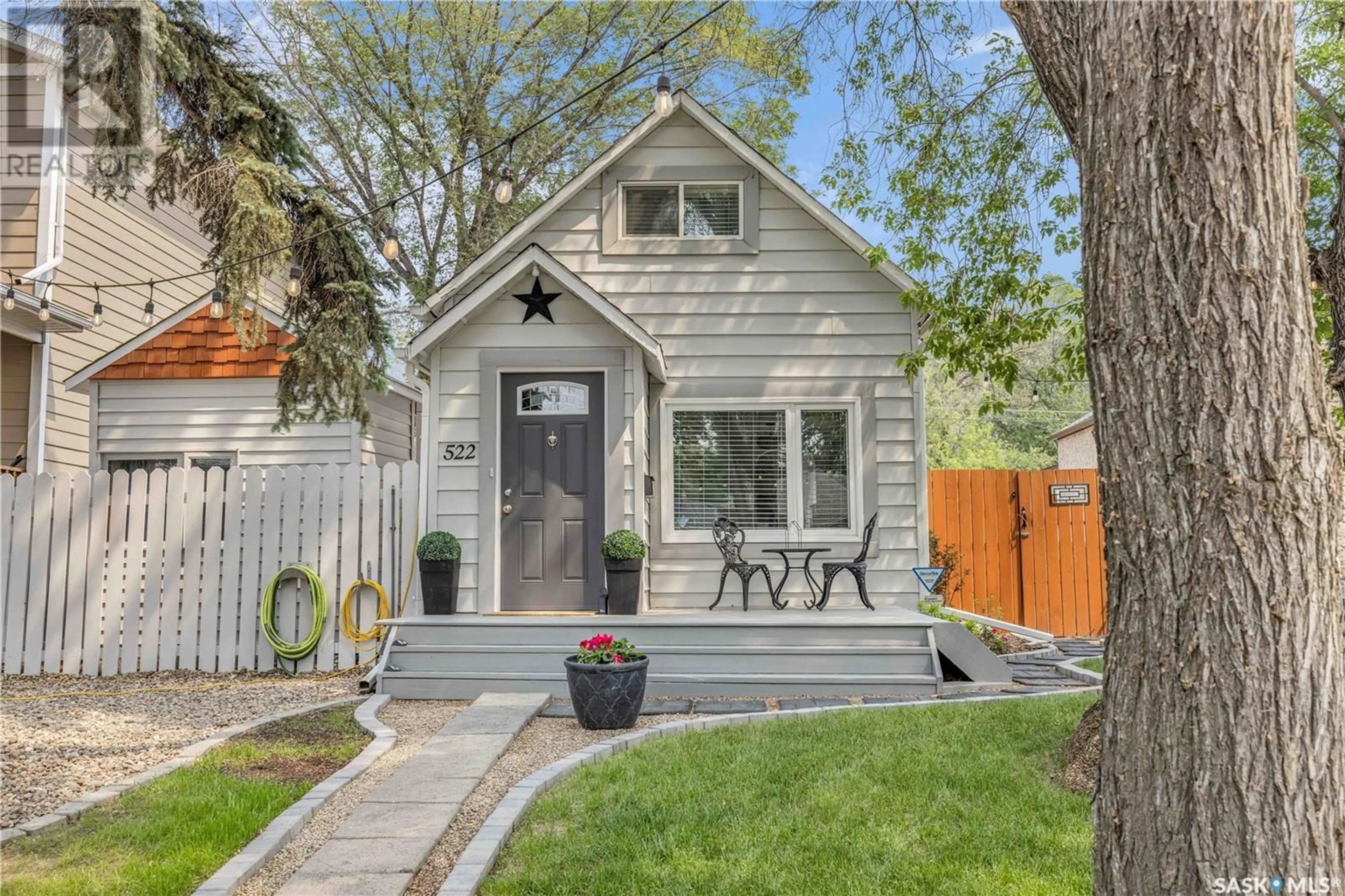 Home with vinyl exterior material, street for 522 K AVENUE, Saskatoon Saskatchewan S7H0M3