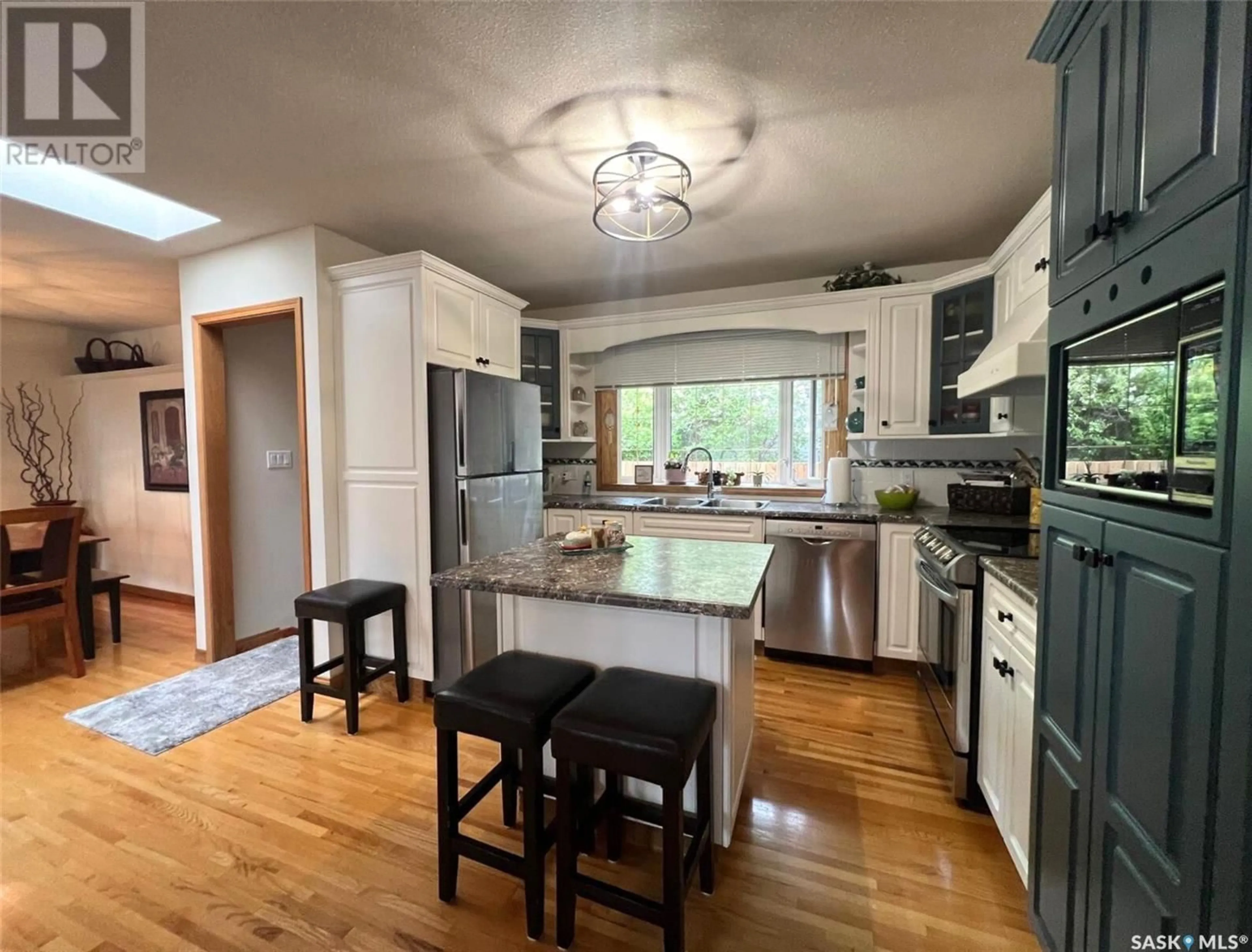 Open concept kitchen, wood/laminate floor for 1143 RIVERVIEW CRESCENT, Swift Current Saskatchewan S9H1Y8