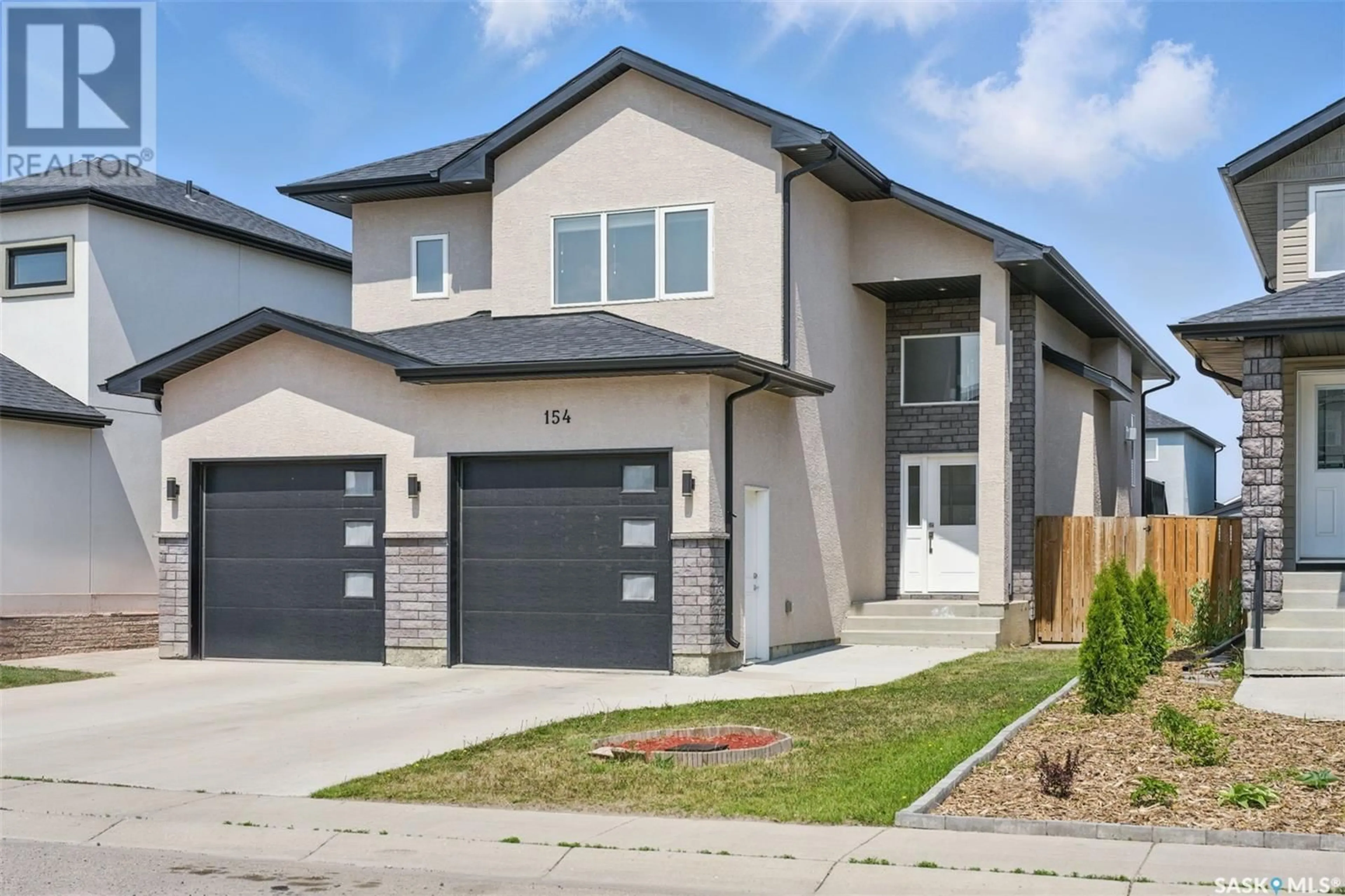 Home with brick exterior material, street for 154 FAST CRESCENT, Saskatoon Saskatchewan S7W0W9