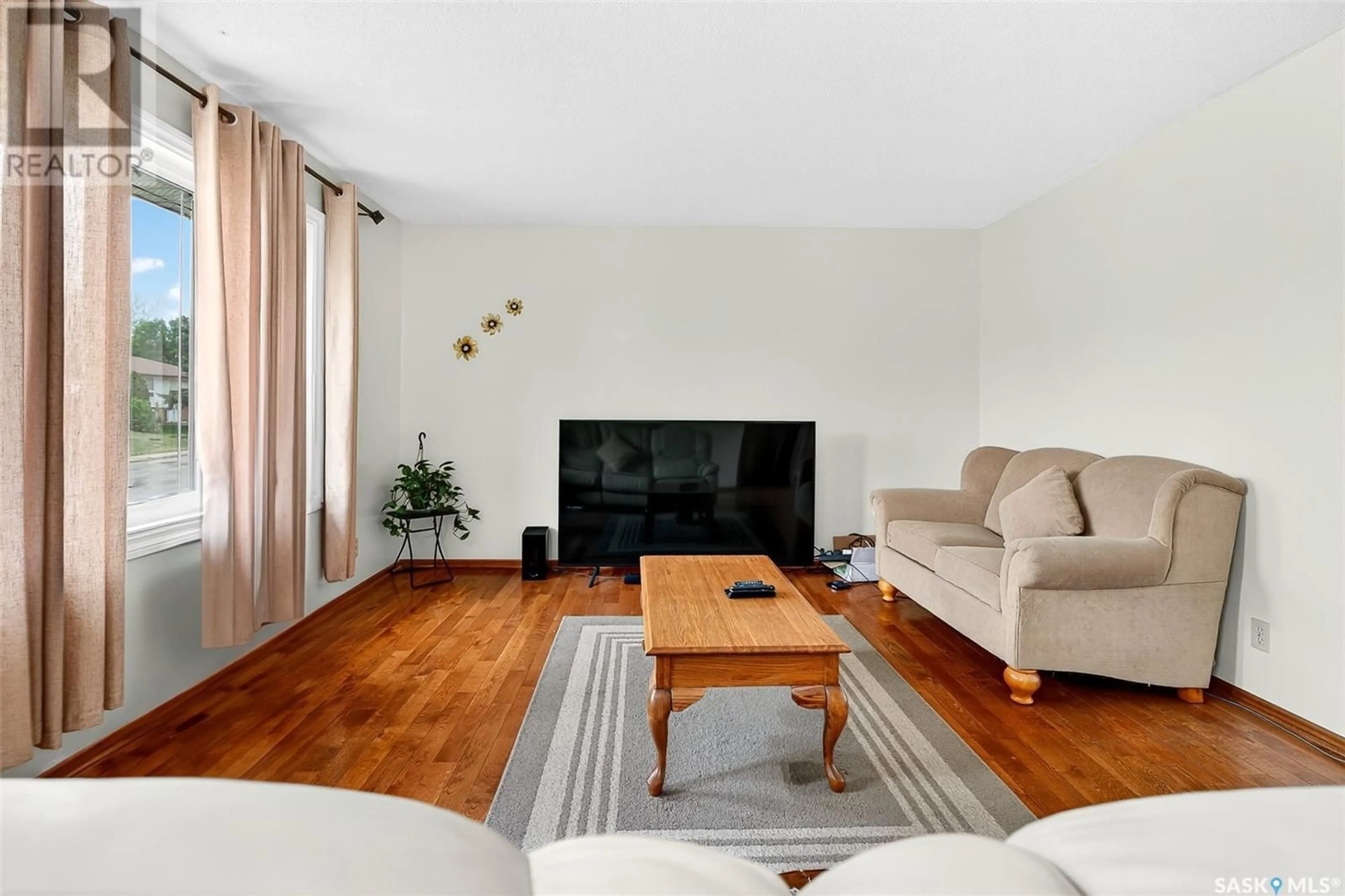 Living room with furniture, wood/laminate floor for 1303 ATHABASCA STREET, Moose Jaw Saskatchewan S6H6C8