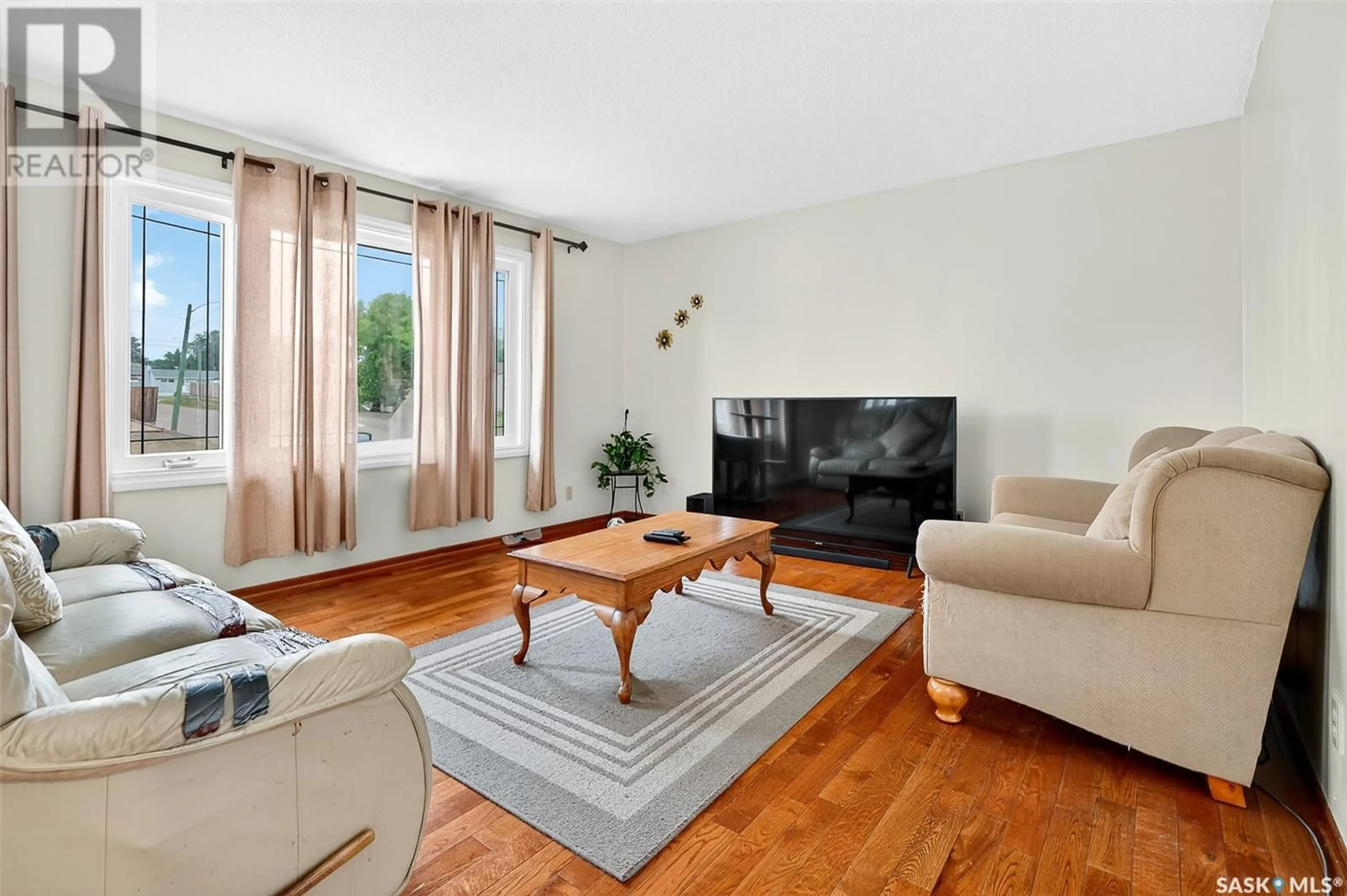 Living room with furniture, wood/laminate floor for 1303 ATHABASCA STREET, Moose Jaw Saskatchewan S6H6C8