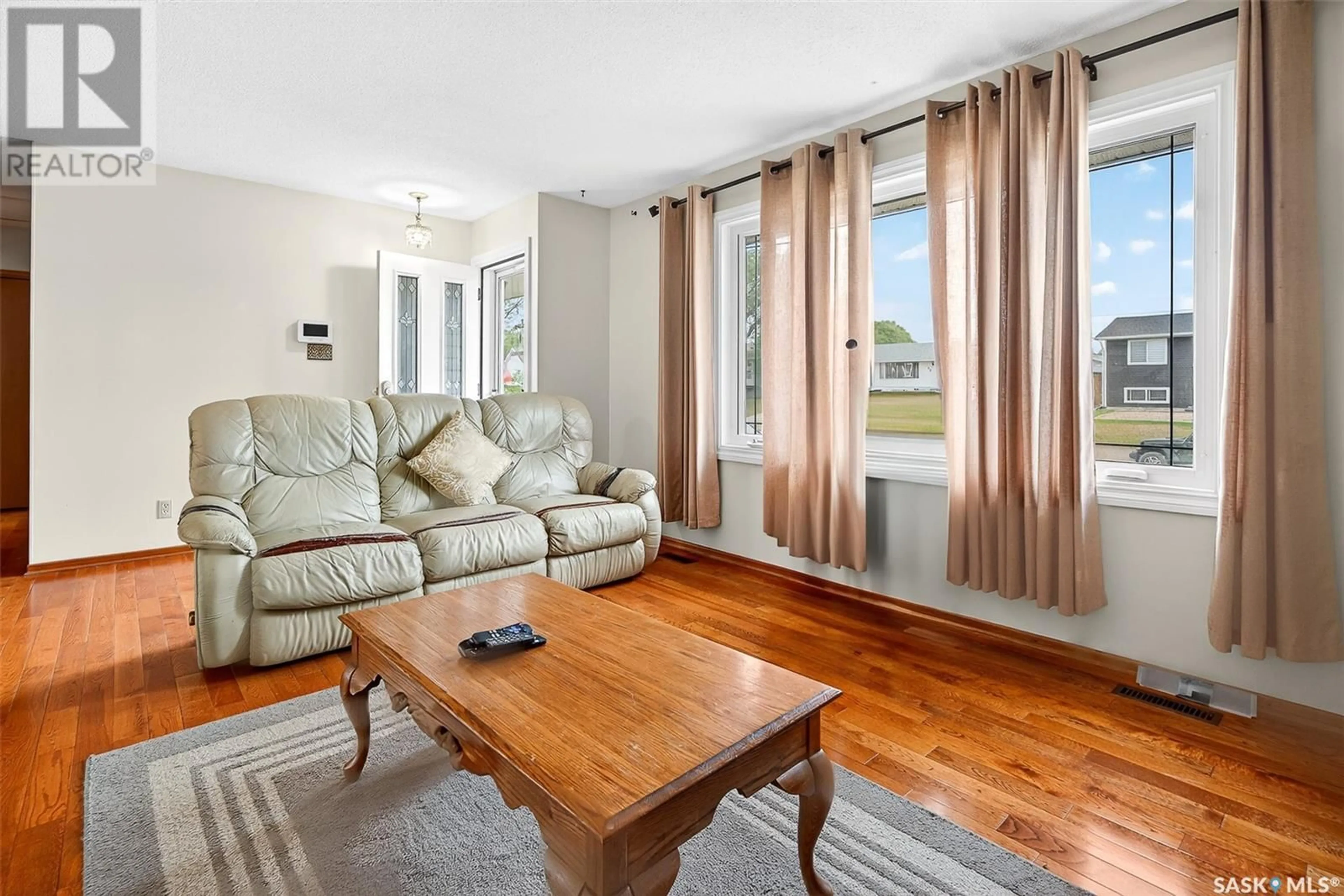 Living room with furniture, wood/laminate floor for 1303 ATHABASCA STREET, Moose Jaw Saskatchewan S6H6C8