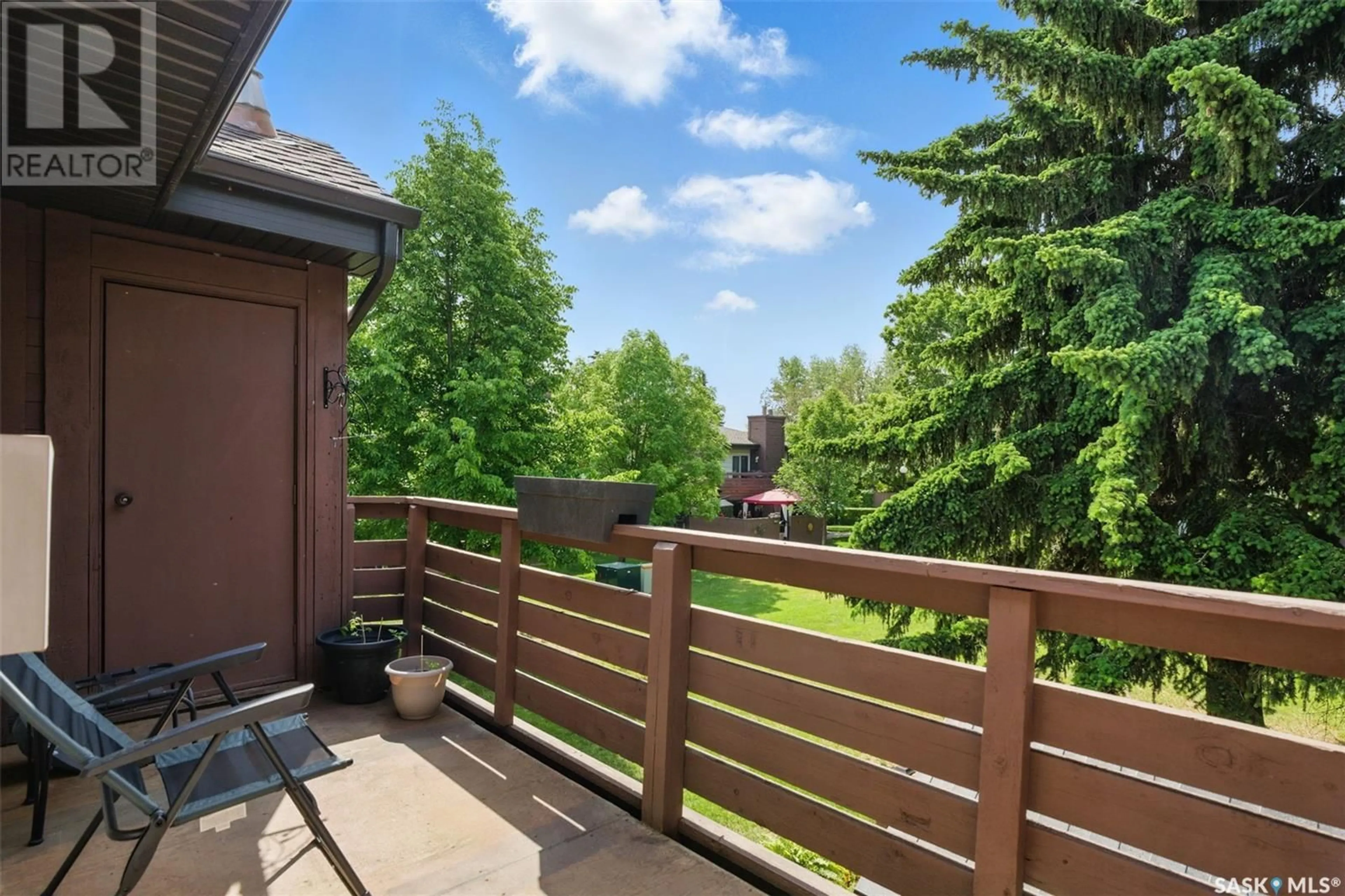 Patio, forest/trees view for 203 - 443 PENDYGRASSE ROAD, Saskatoon Saskatchewan S7M5C1