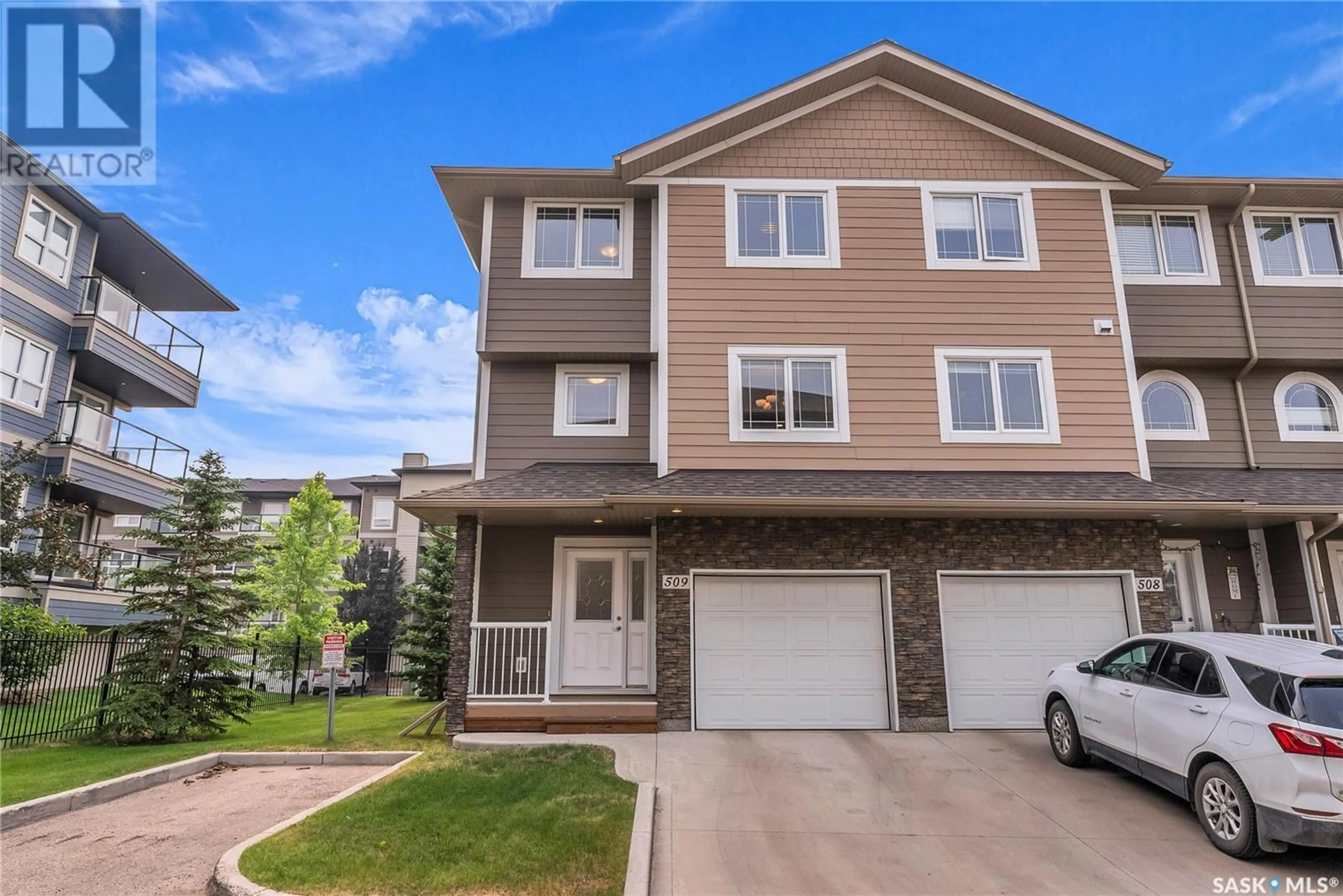 Home with vinyl exterior material, street for 212 - 509 WILLIS CRESCENT, Saskatoon Saskatchewan S7T0R7