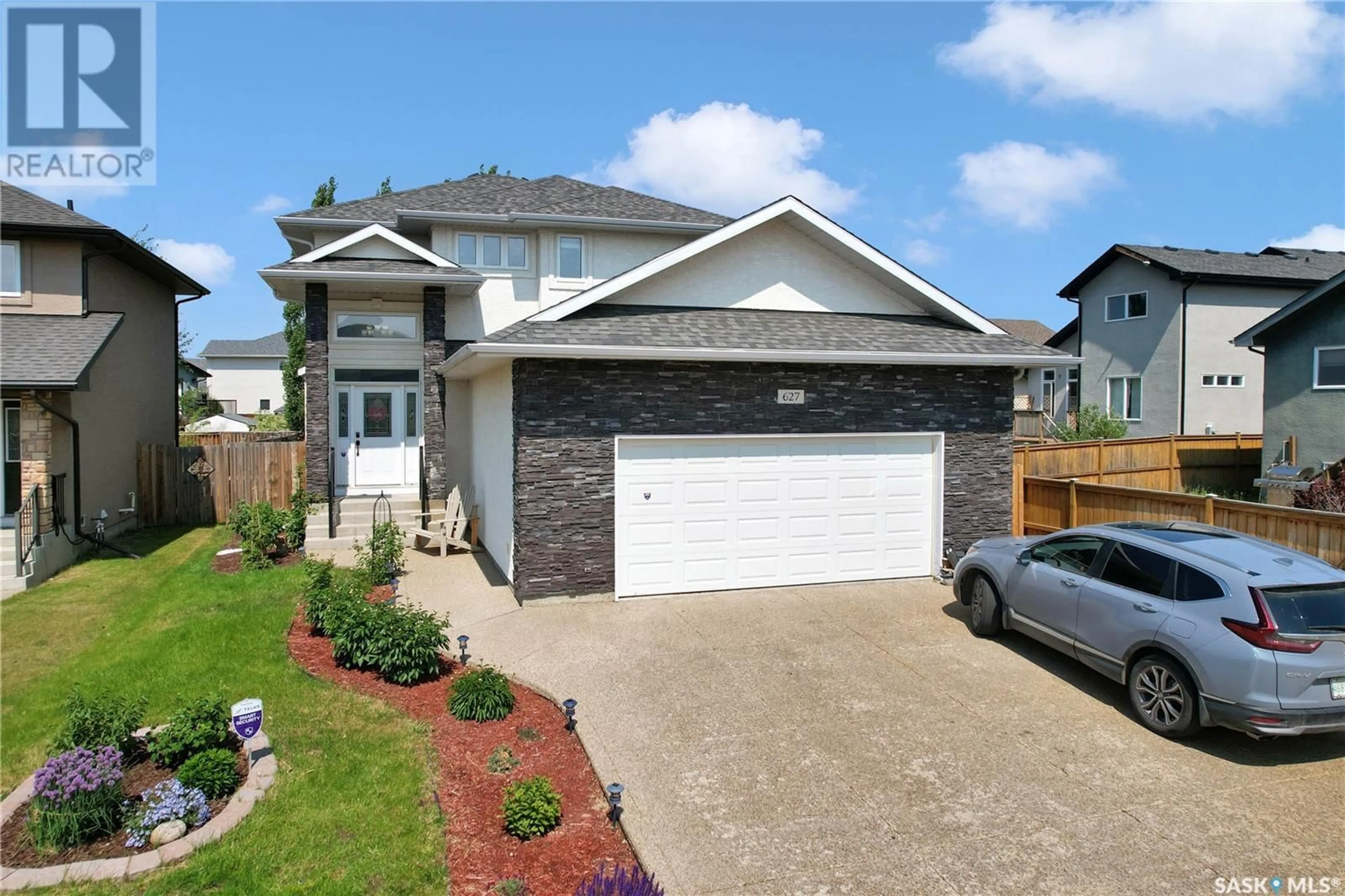 Home with brick exterior material, street for 627 REMPEL CRESCENT, Saskatoon Saskatchewan S7T0J2