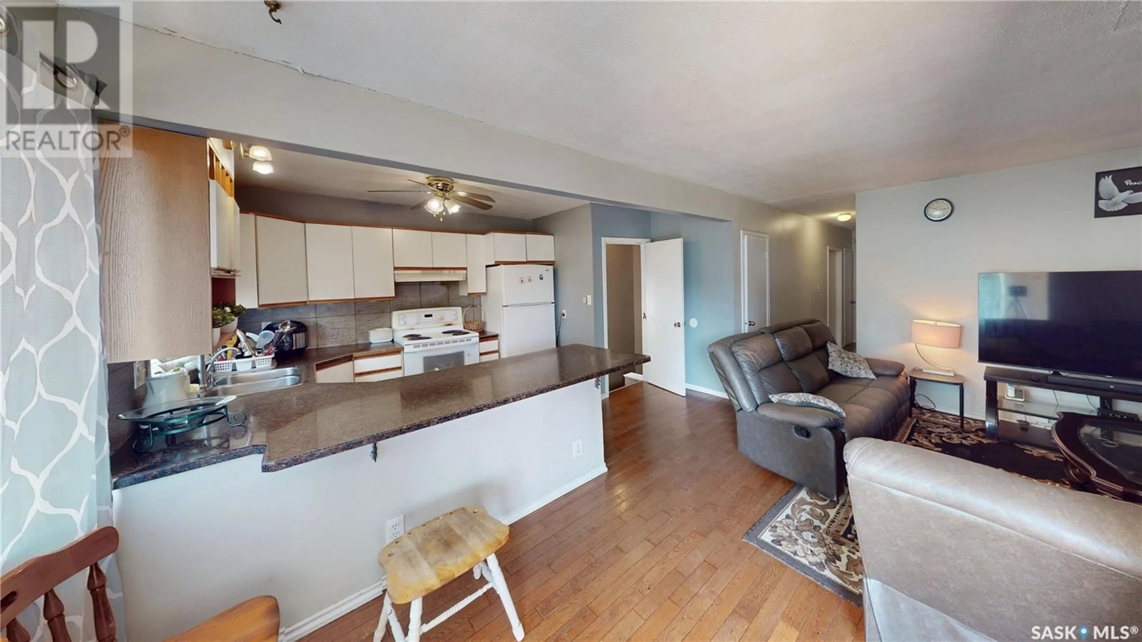 Open concept kitchen, wood/laminate floor for 54 FROOM CRESCENT, Regina Saskatchewan S4N0T9