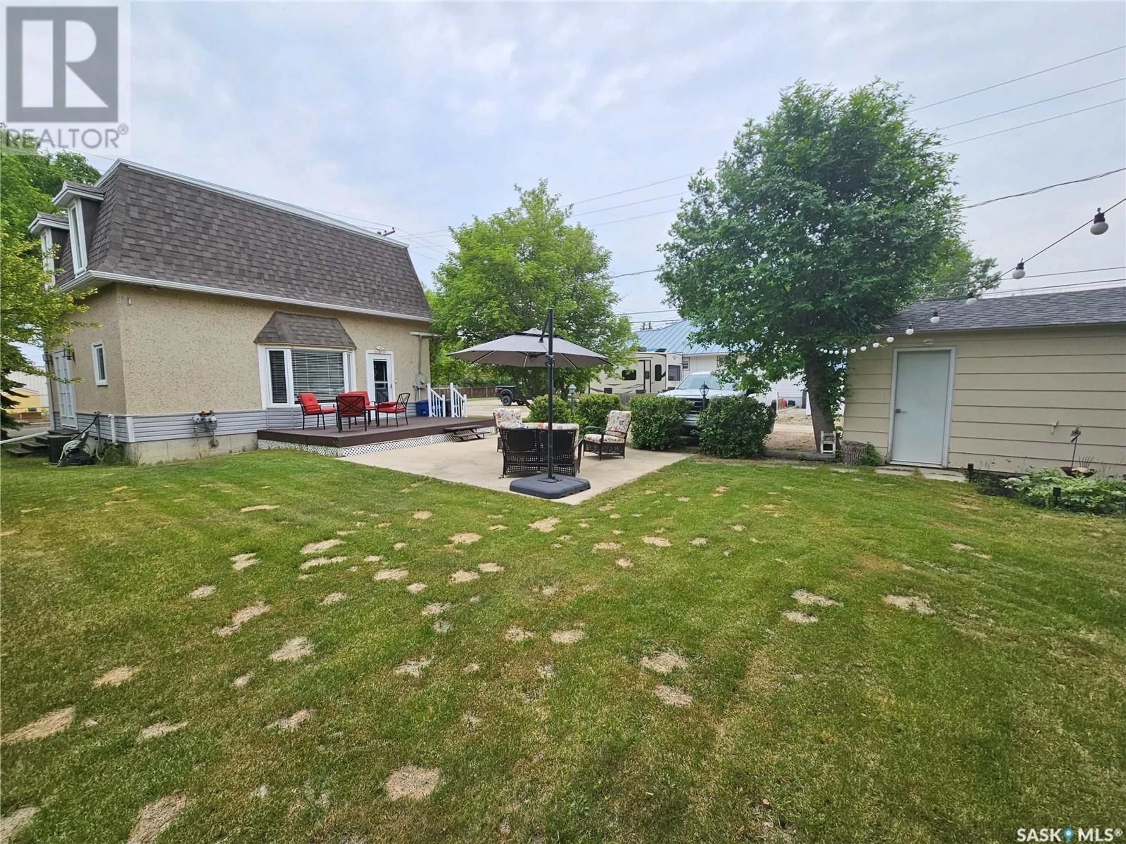 A pic from outside/outdoor area/front of a property/back of a property/a pic from drone, water/lake/river/ocean view for 202 SOURIS AVENUE, Carlyle Saskatchewan S0C0R0