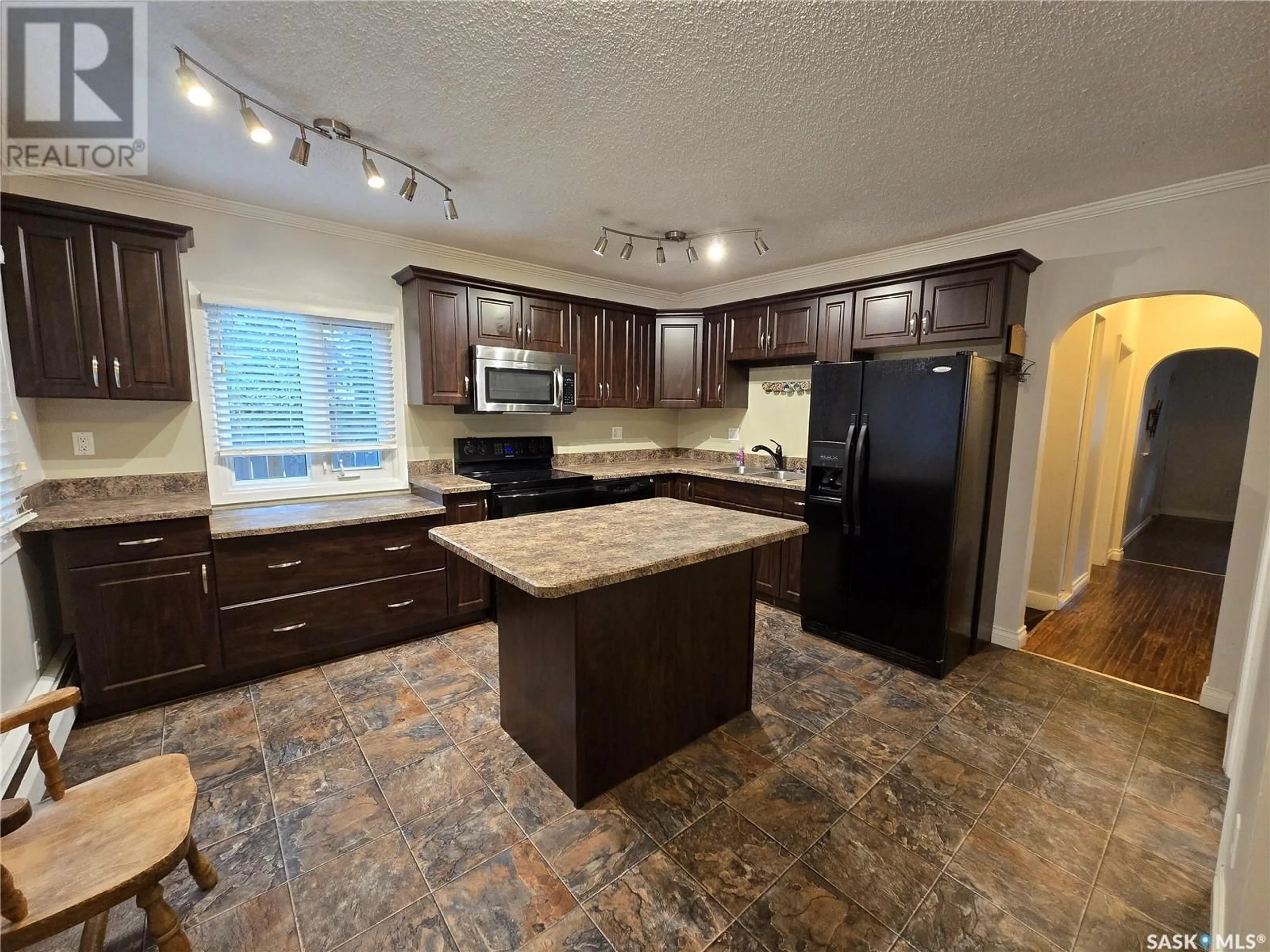 Open concept kitchen, ceramic/tile floor for E - 300 MAPLE STREET, Saskatoon Saskatchewan S7J0A5