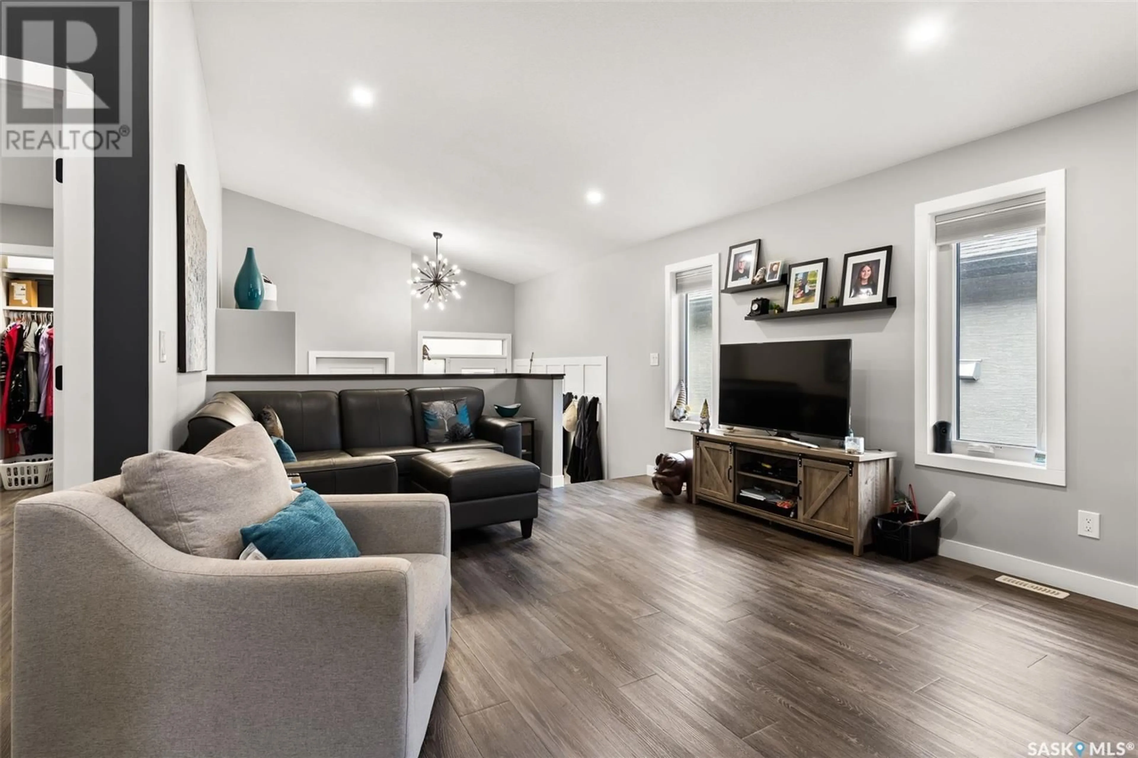 Living room with furniture, wood/laminate floor for 1609 MAPLE STREET, Regina Saskatchewan S4X0P3
