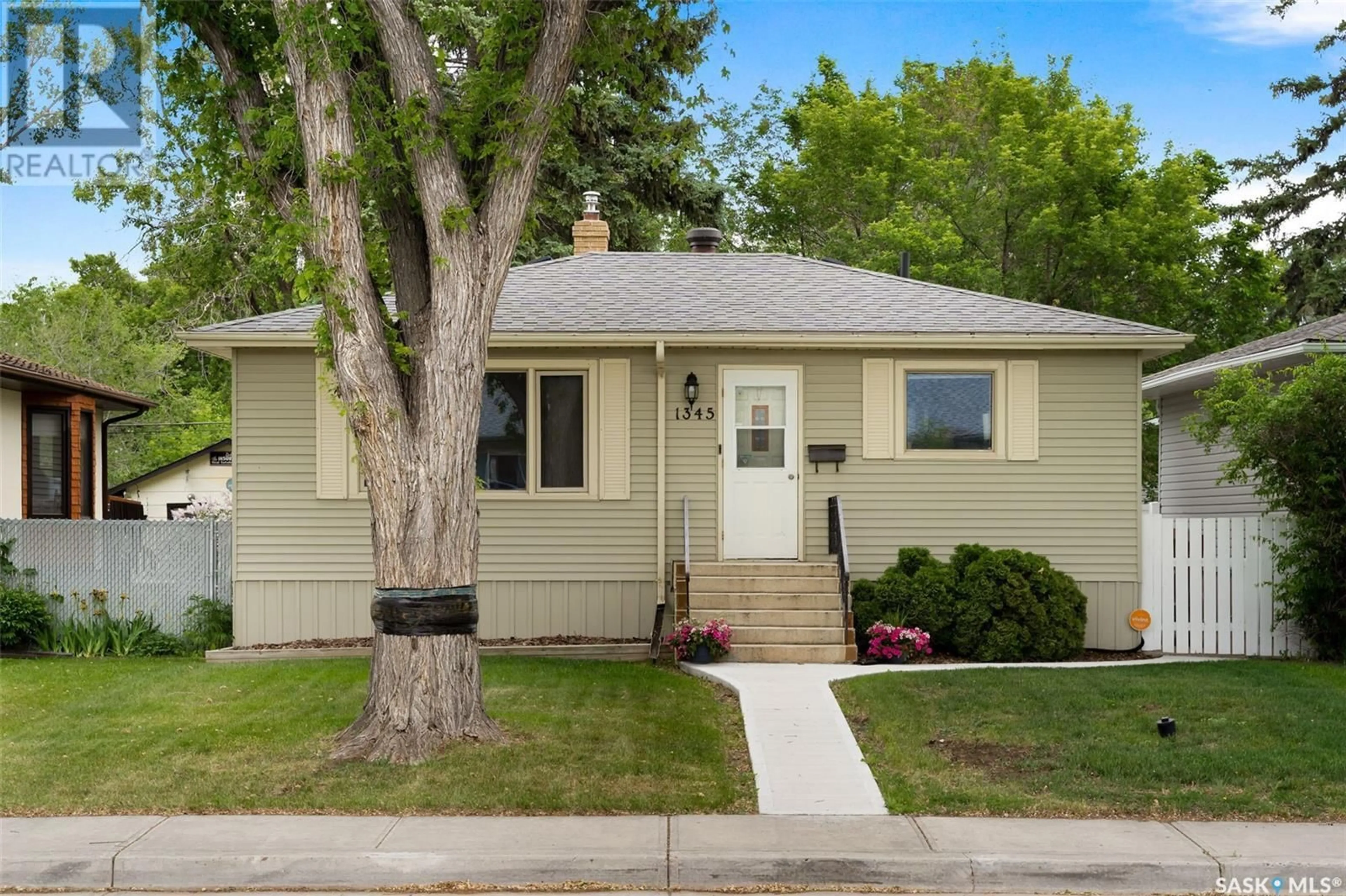Home with vinyl exterior material, street for 1345 ROYAL STREET, Regina Saskatchewan S4T5A2