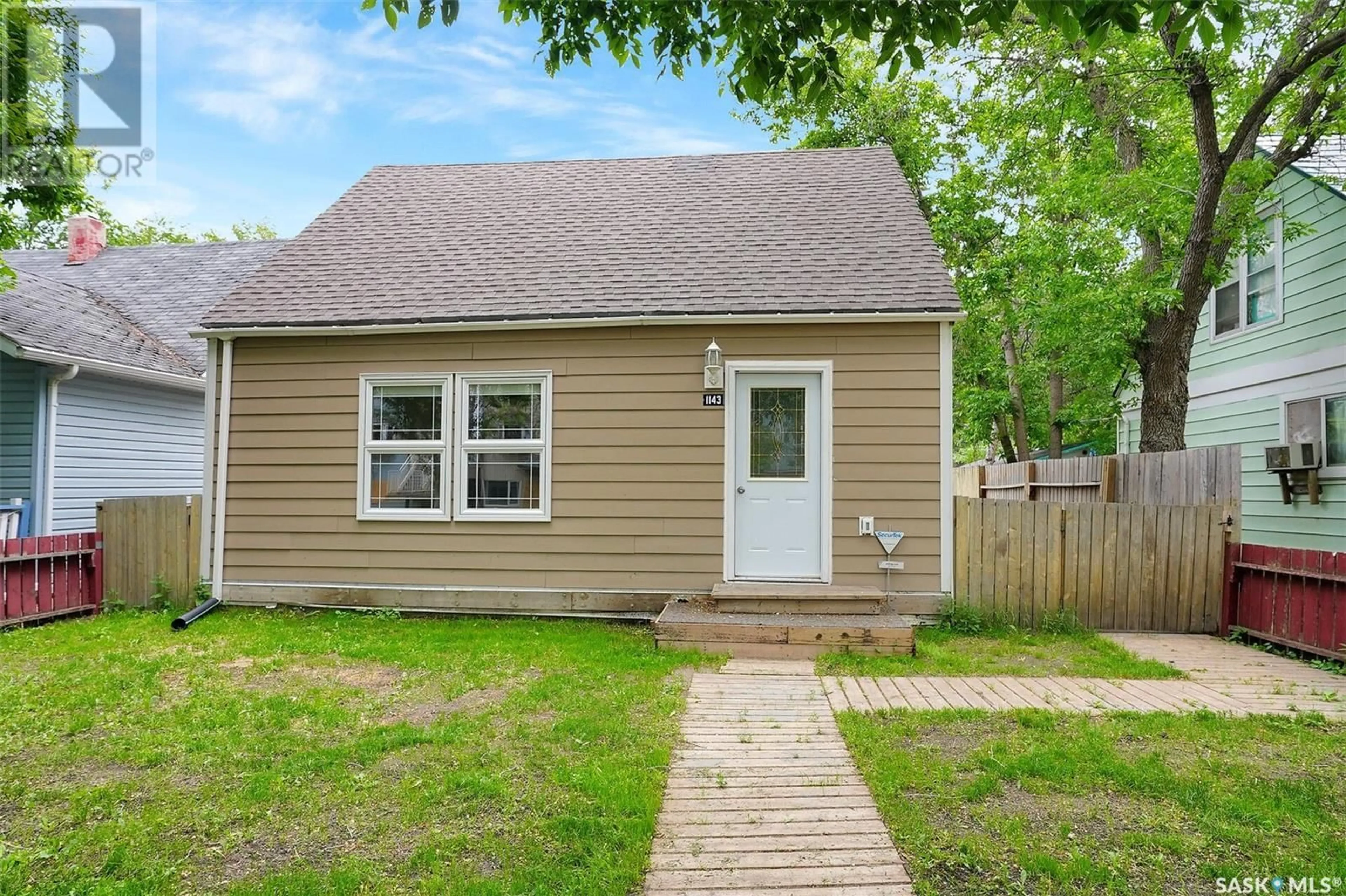 Home with vinyl exterior material, street for 1143 WASCANA STREET, Regina Saskatchewan S4T4H9
