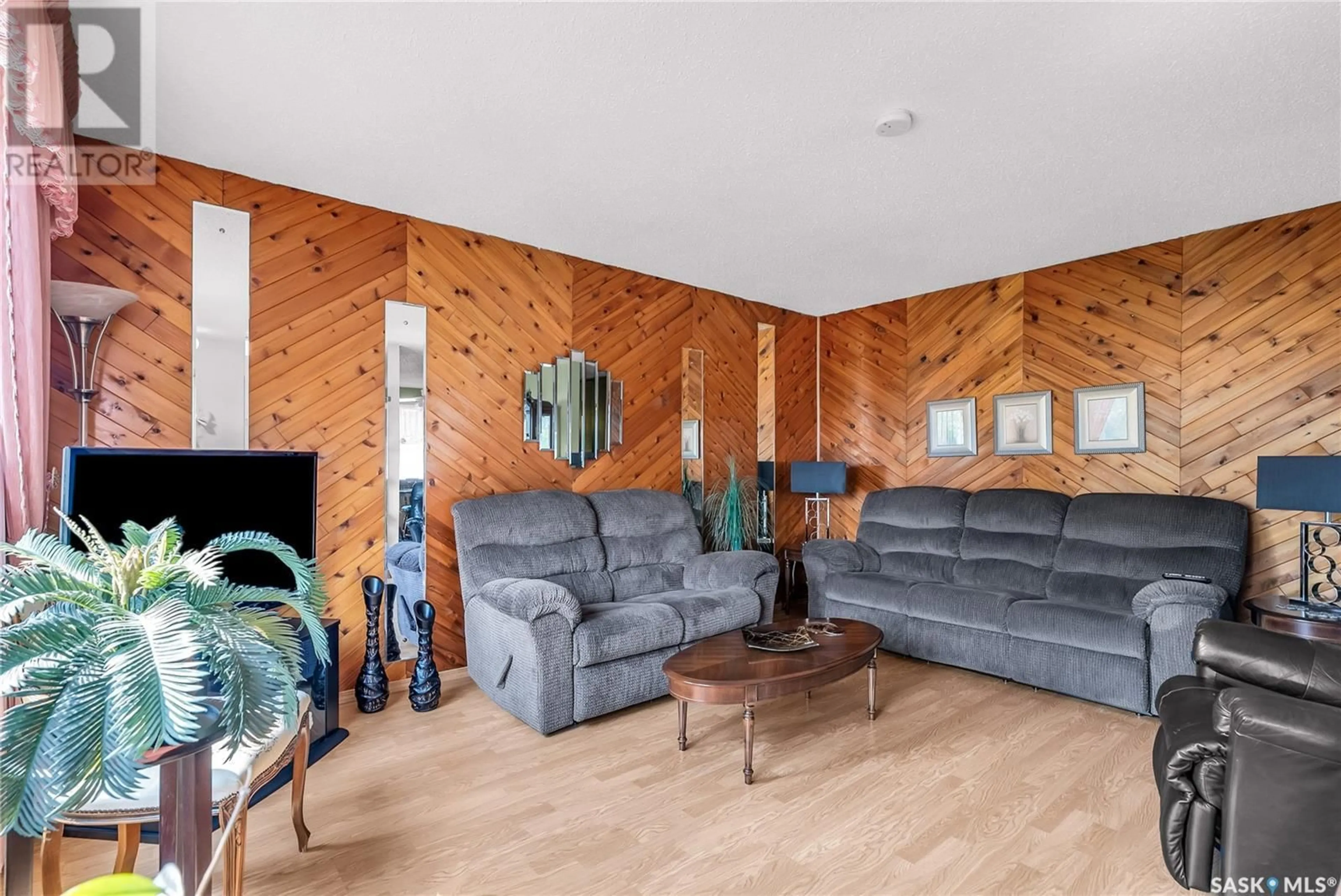 Living room with furniture, wood/laminate floor for 629 16TH STREET, Humboldt Saskatchewan S0K2A0