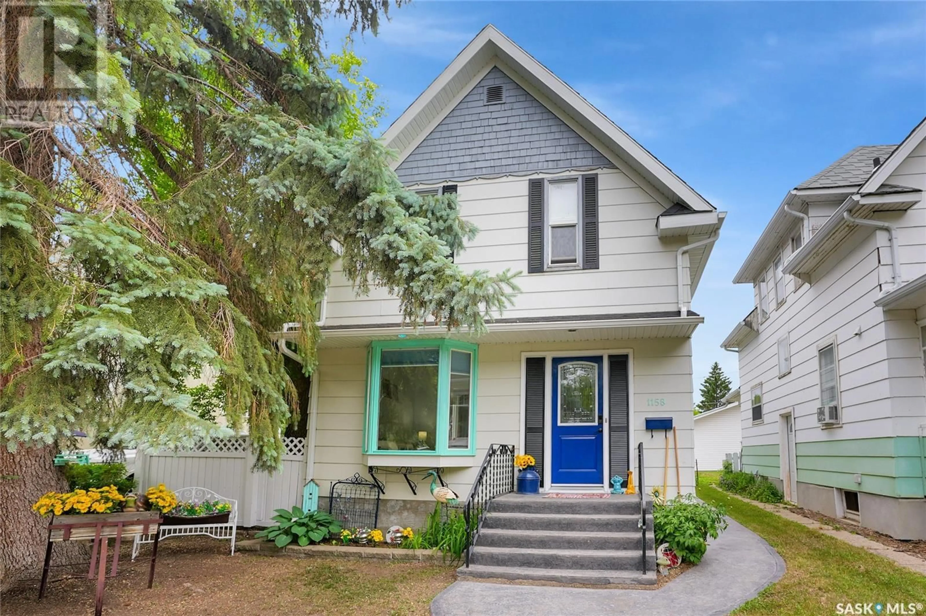 Home with vinyl exterior material, street for 1158 ALDER AVENUE, Moose Jaw Saskatchewan S6H0Y7