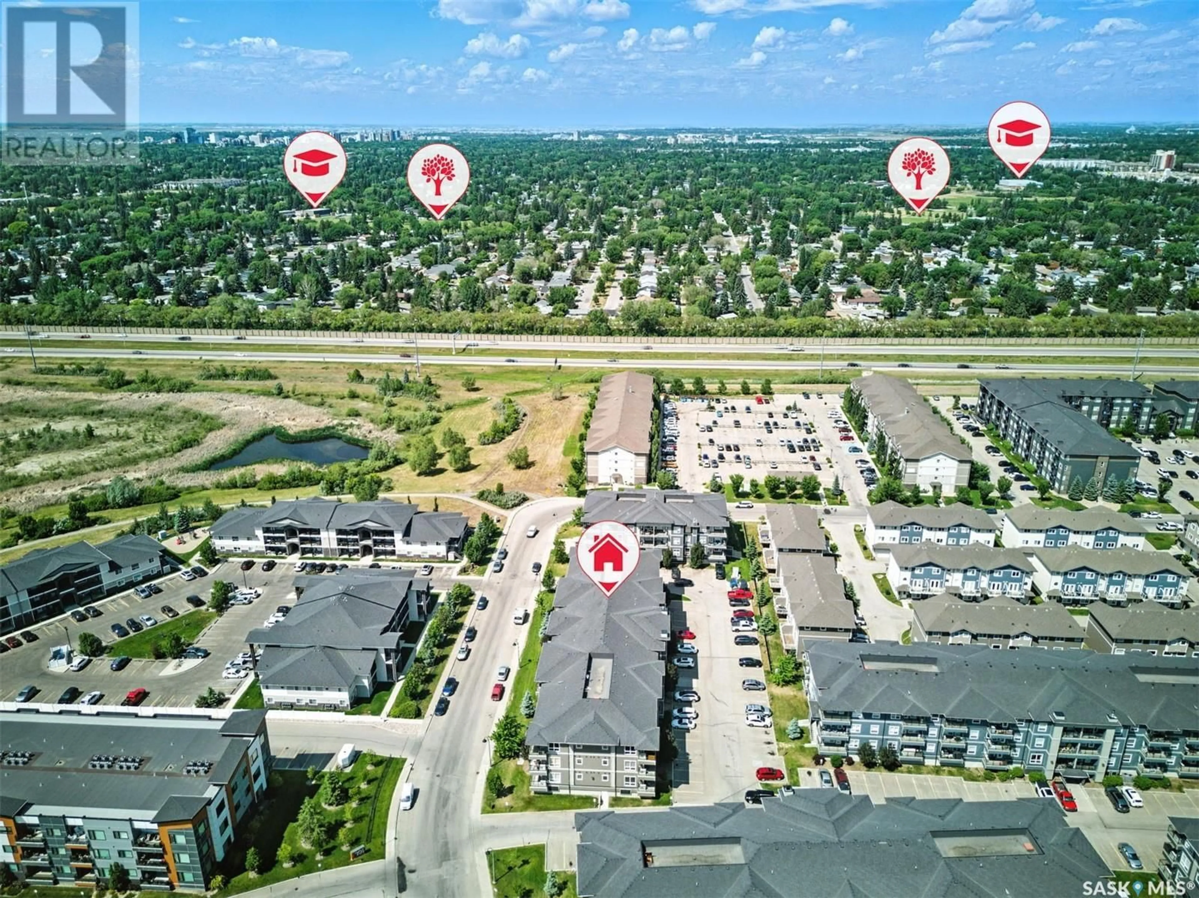 A pic from outside/outdoor area/front of a property/back of a property/a pic from drone, street for 110 - 5202 WILLIS CRESCENT, Saskatoon Saskatchewan S7T0N5