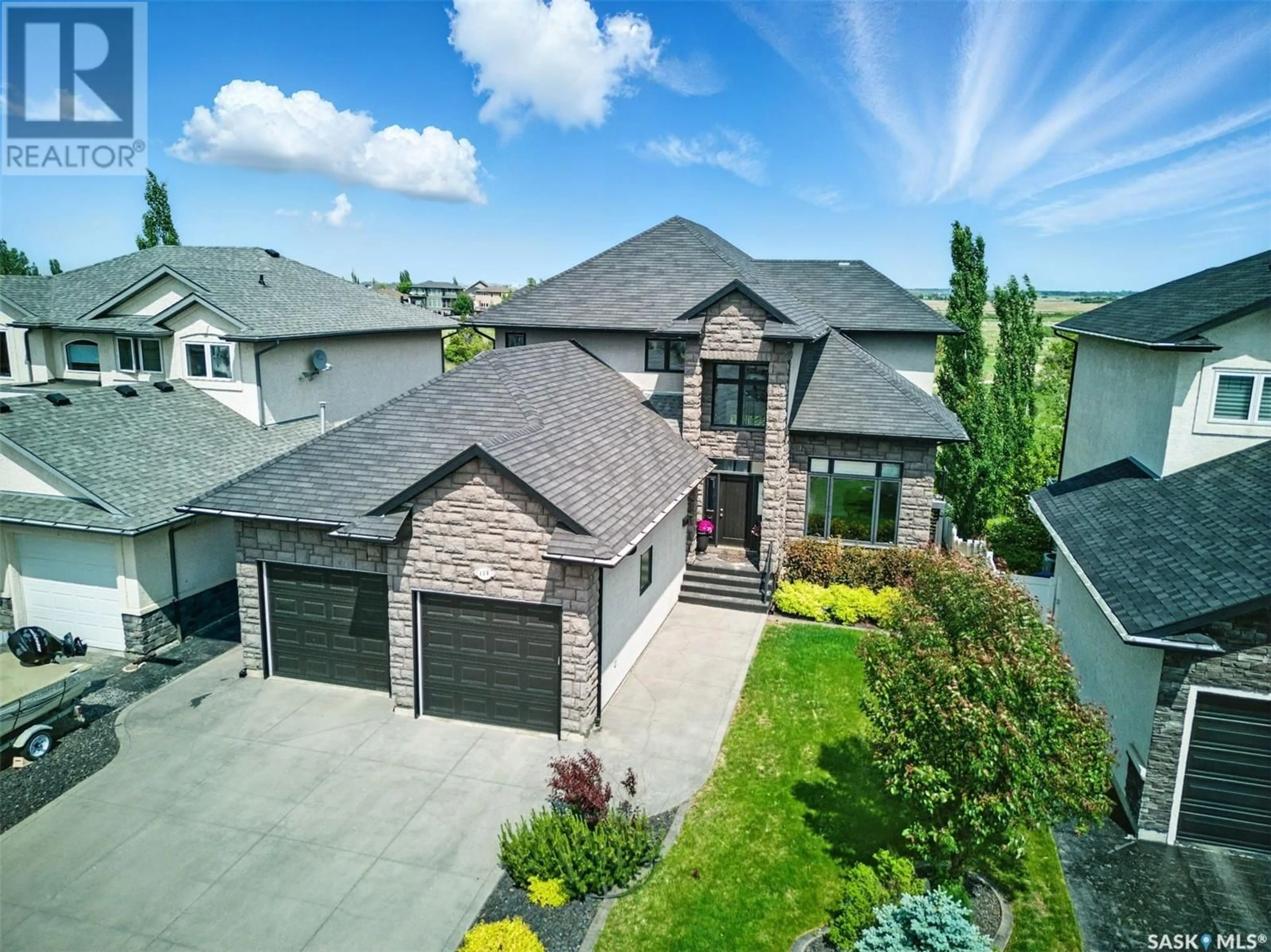 A pic from outside/outdoor area/front of a property/back of a property/a pic from drone, street for 739 BEECHDALE WAY, Saskatoon Saskatchewan S7V0A5