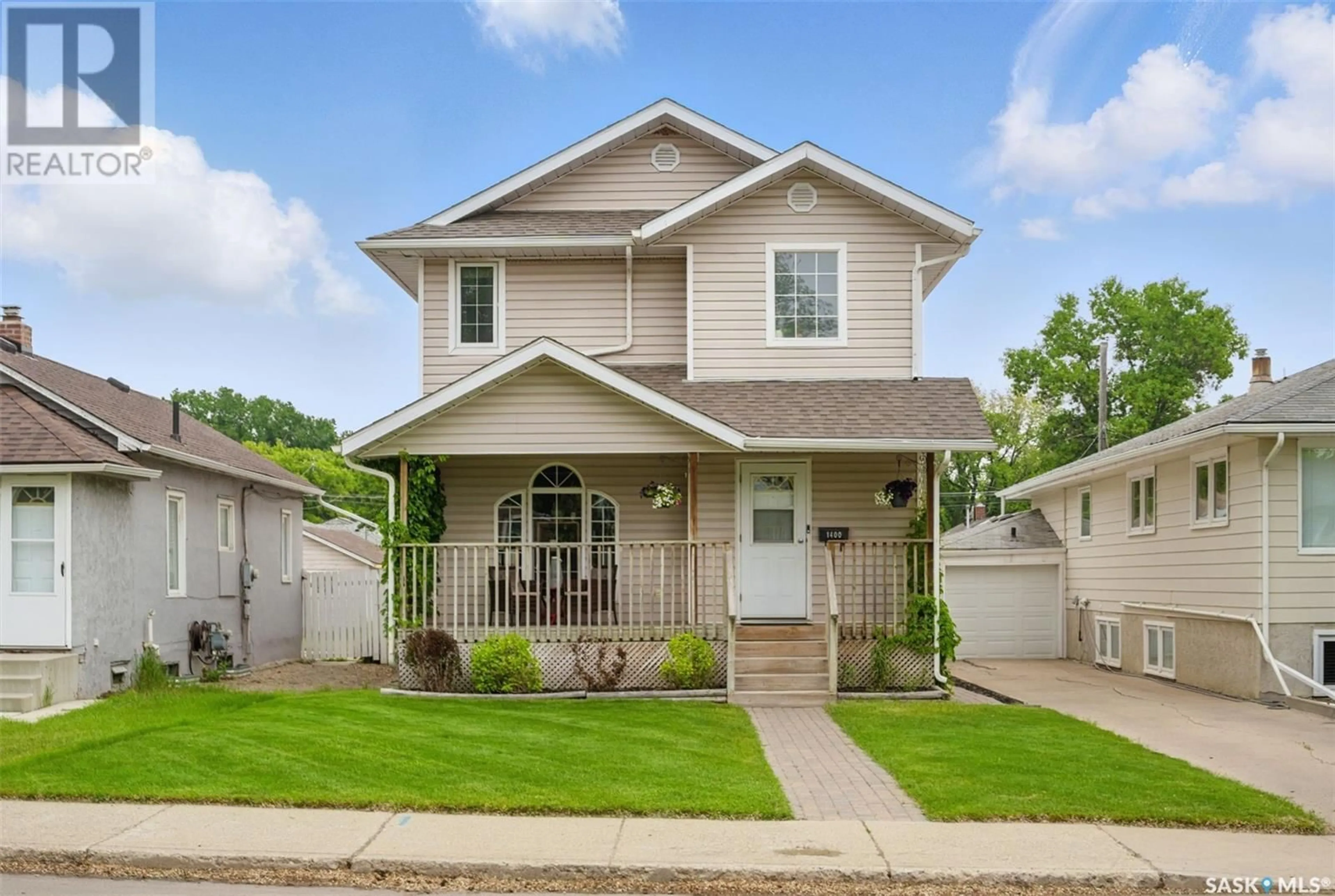 Home with vinyl exterior material, street for 1400 6TH AVENUE, Saskatoon Saskatchewan S7K2T8