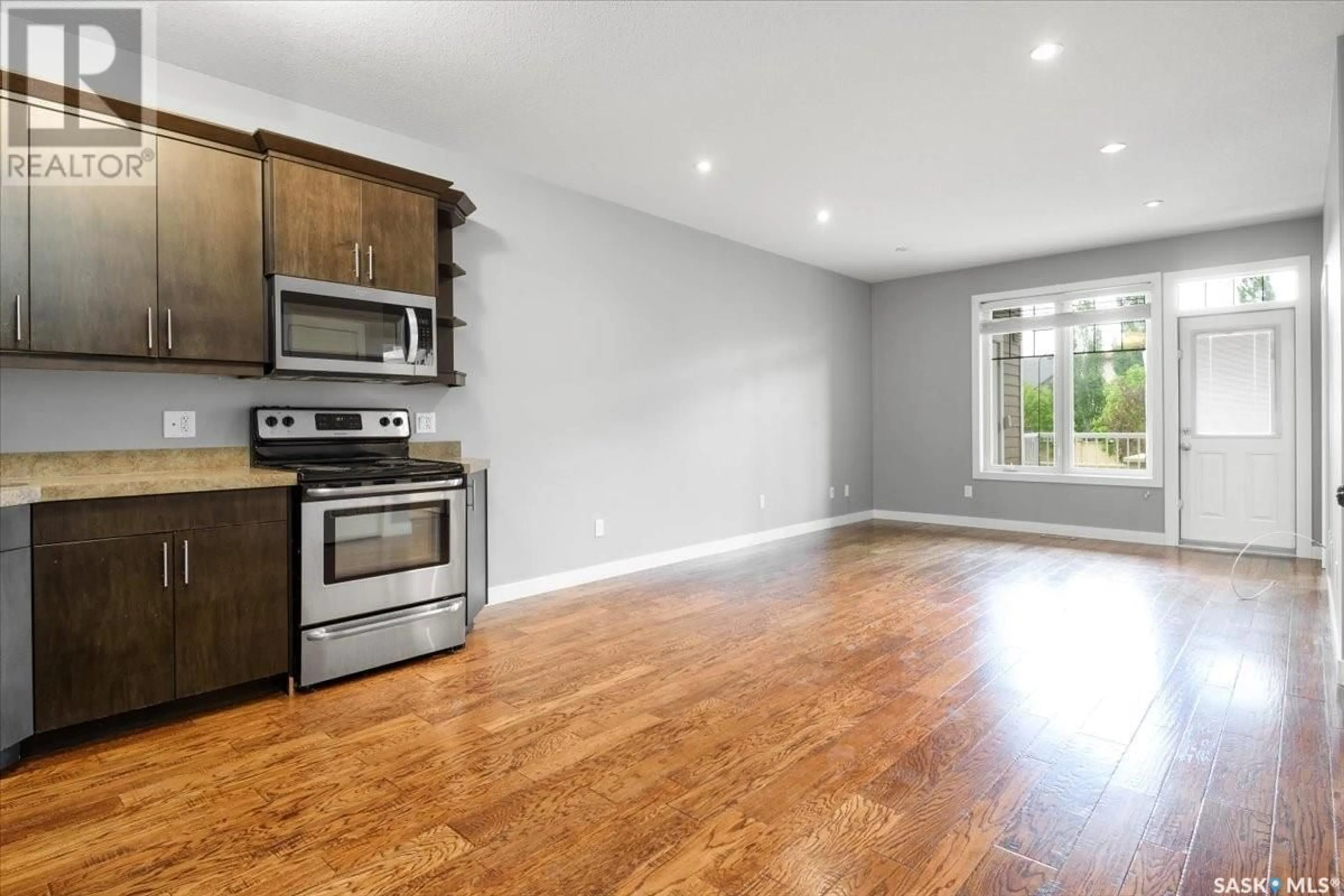 Open concept kitchen, wood/laminate floor for 3241 GREEN BANK ROAD, Regina Saskatchewan S4V2Z6