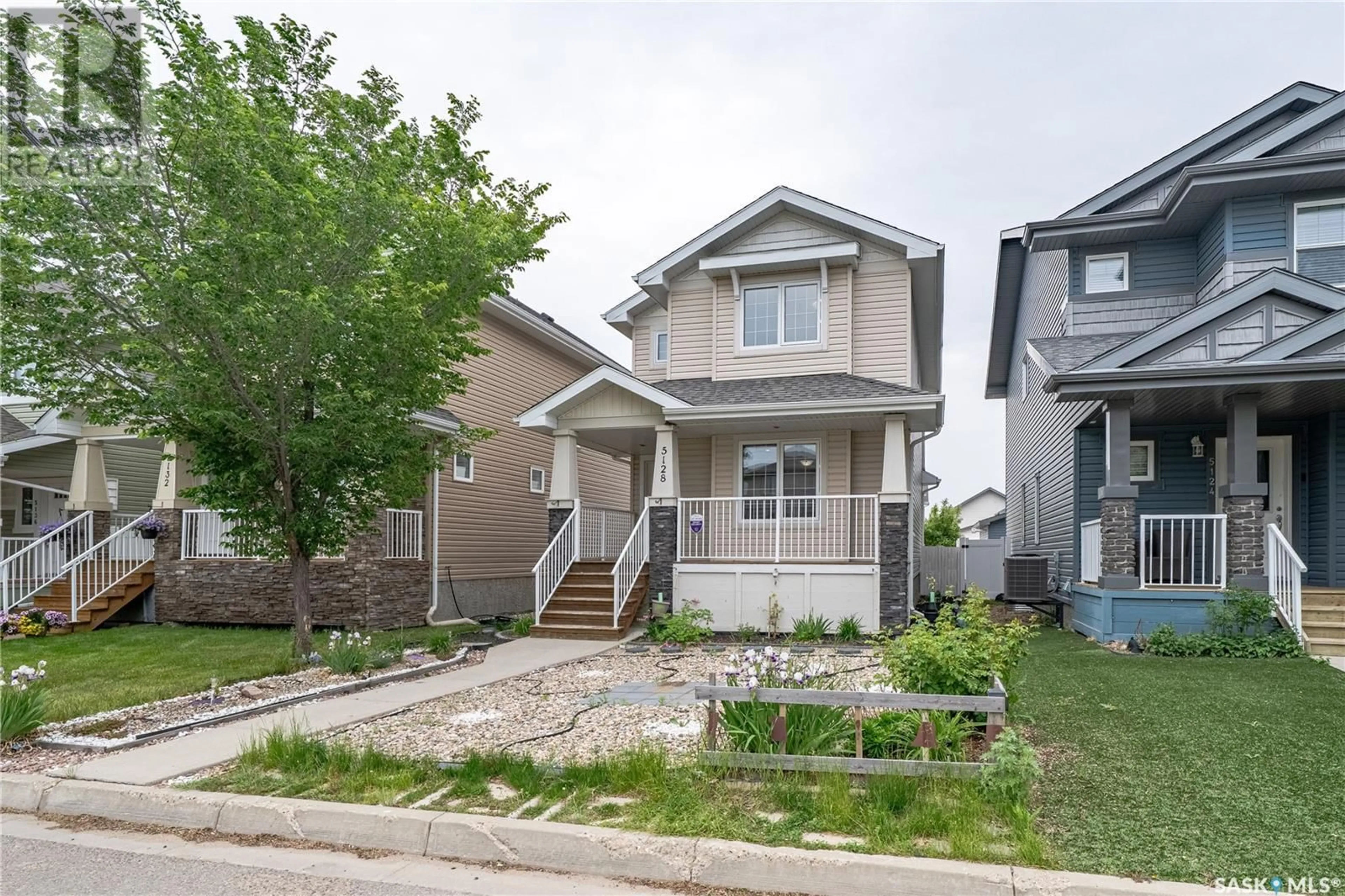 Home with vinyl exterior material, street for 5128 AERIAL CRESCENT, Regina Saskatchewan S4W0C8