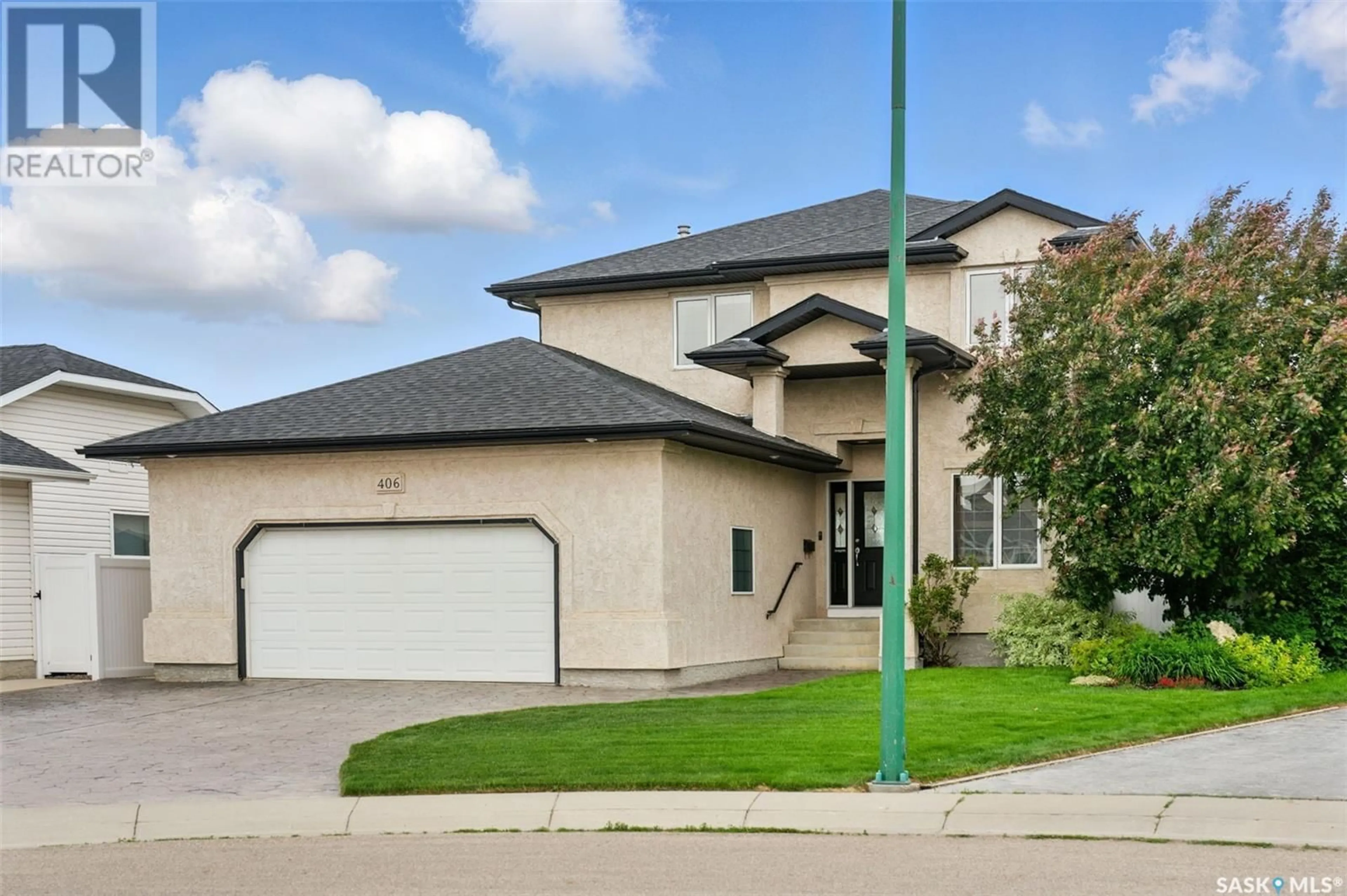 Home with vinyl exterior material, street for 406 POBRAN COURT, Saskatoon Saskatchewan S7S1L4
