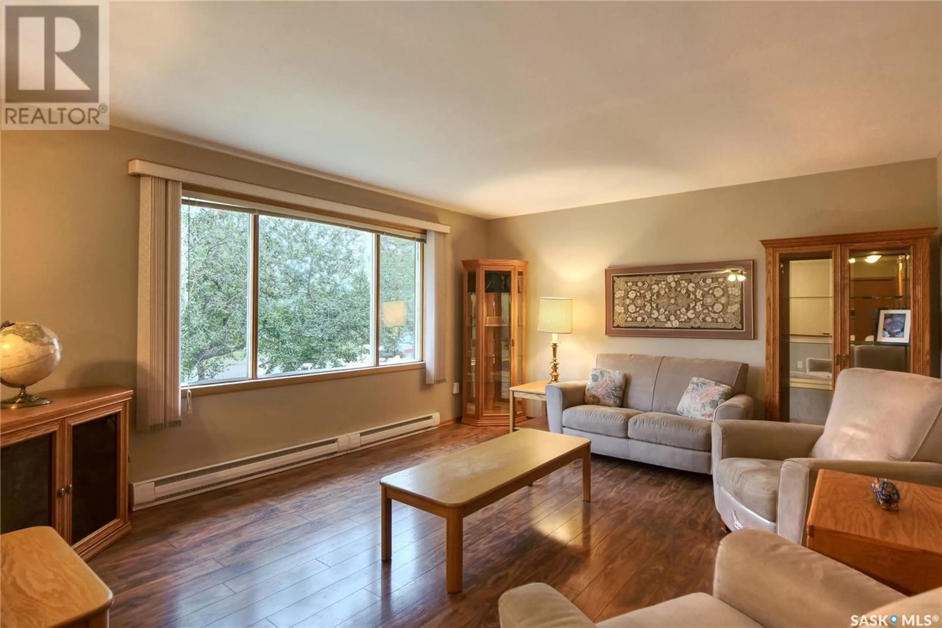 Living room with furniture, wood/laminate floor for 152 7TH AVENUE, Central Butte Saskatchewan S0H0T0