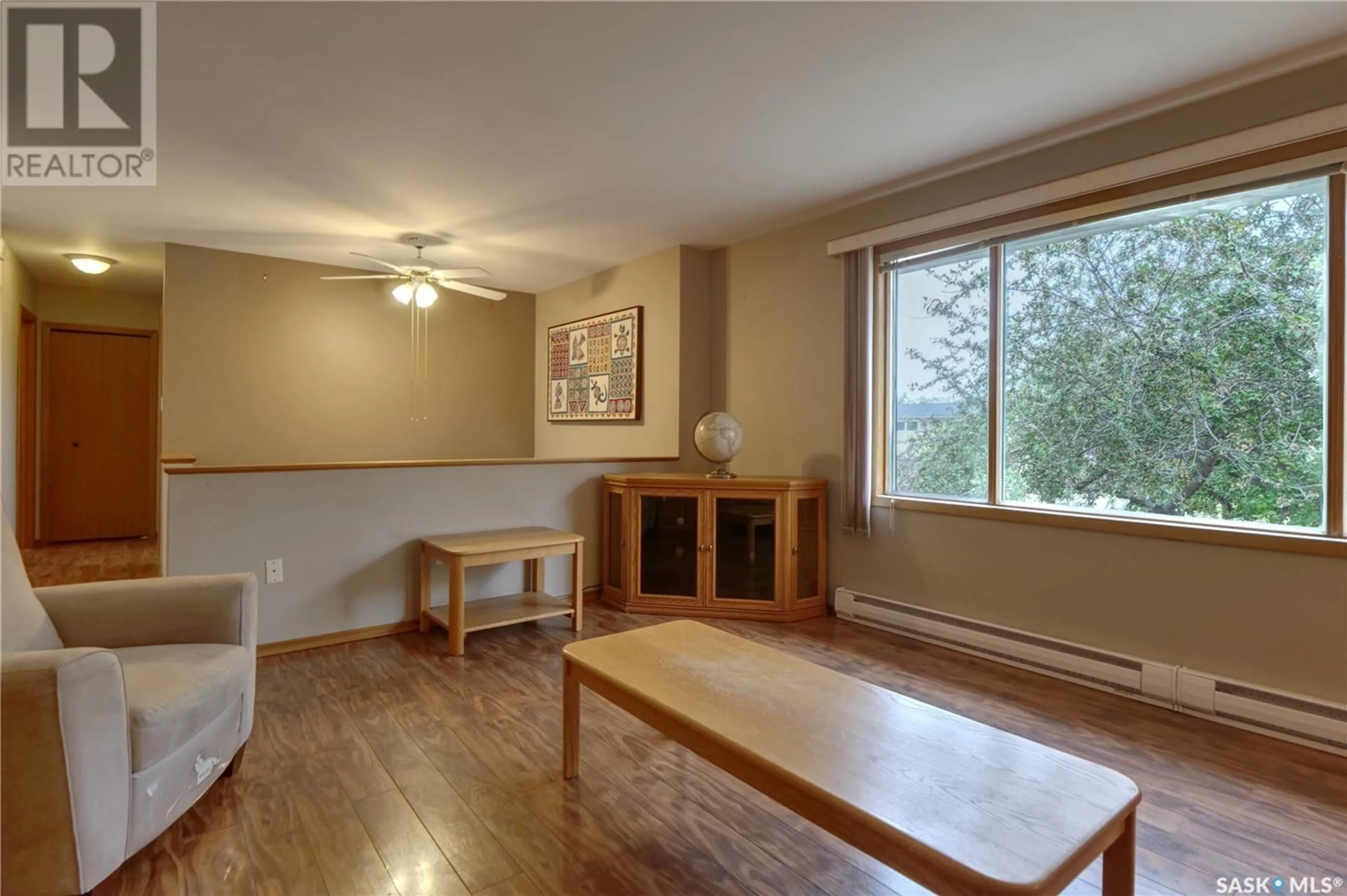 Living room with furniture, wood/laminate floor for 152 7TH AVENUE, Central Butte Saskatchewan S0H0T0