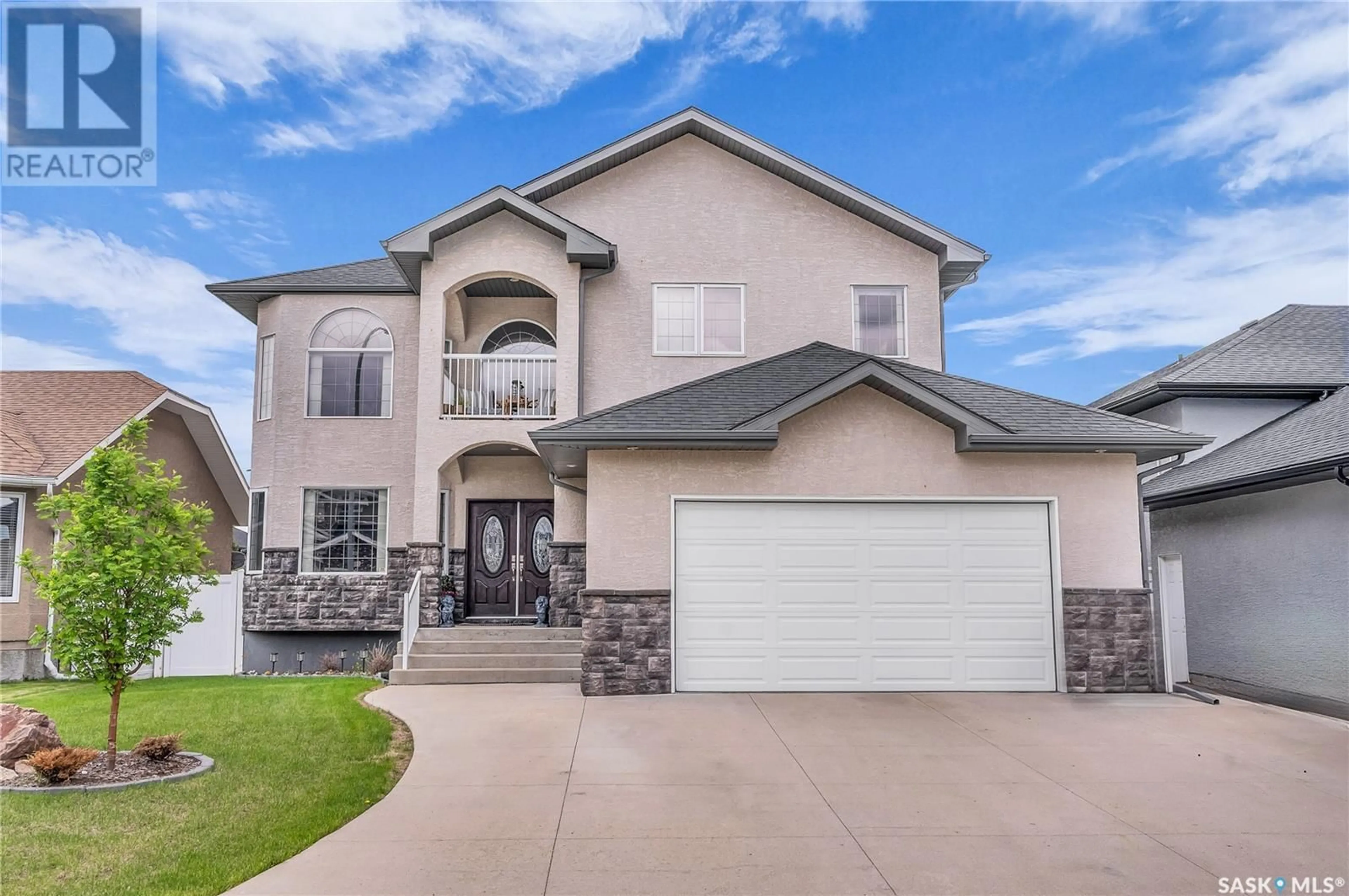 Home with vinyl exterior material, street for 317 NICKLAUS DRIVE, Warman Saskatchewan S0K4S0