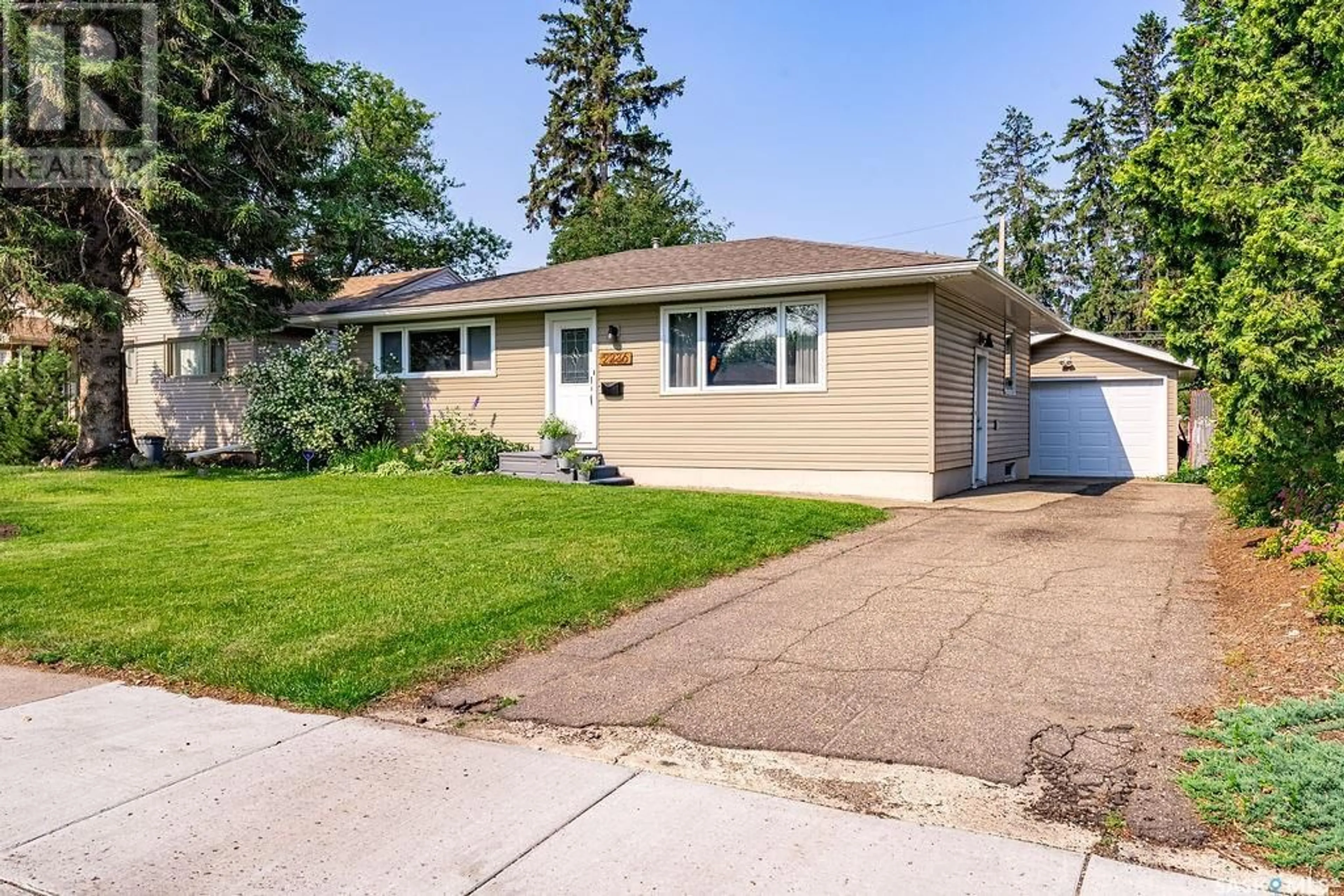 Home with vinyl exterior material, street for 2236 EWART AVENUE, Saskatoon Saskatchewan S7J1Y2