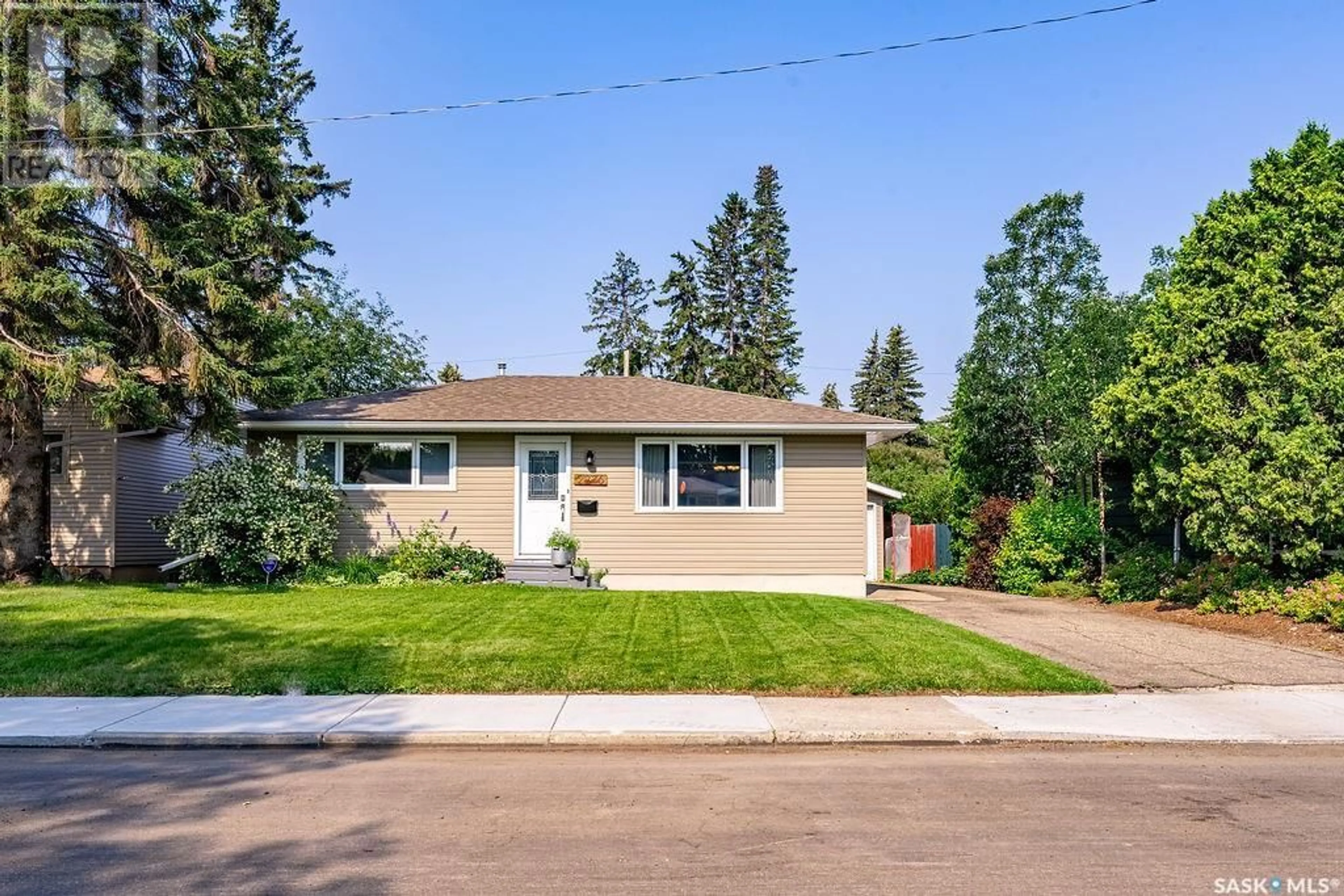 Home with vinyl exterior material, street for 2236 EWART AVENUE, Saskatoon Saskatchewan S7J1Y2