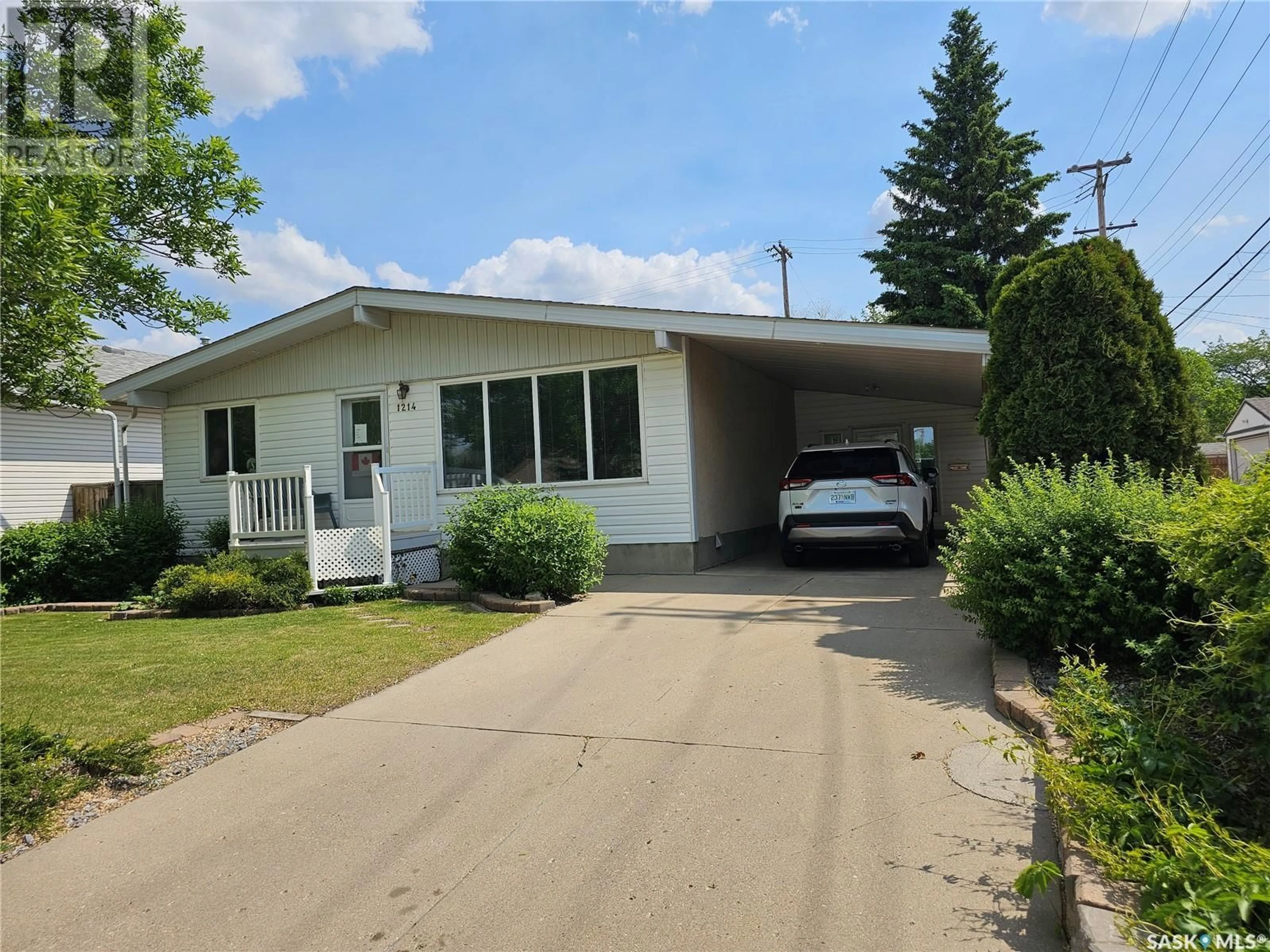 Home with vinyl exterior material, street for 1214 I AVENUE, Saskatoon Saskatchewan S7H1A4