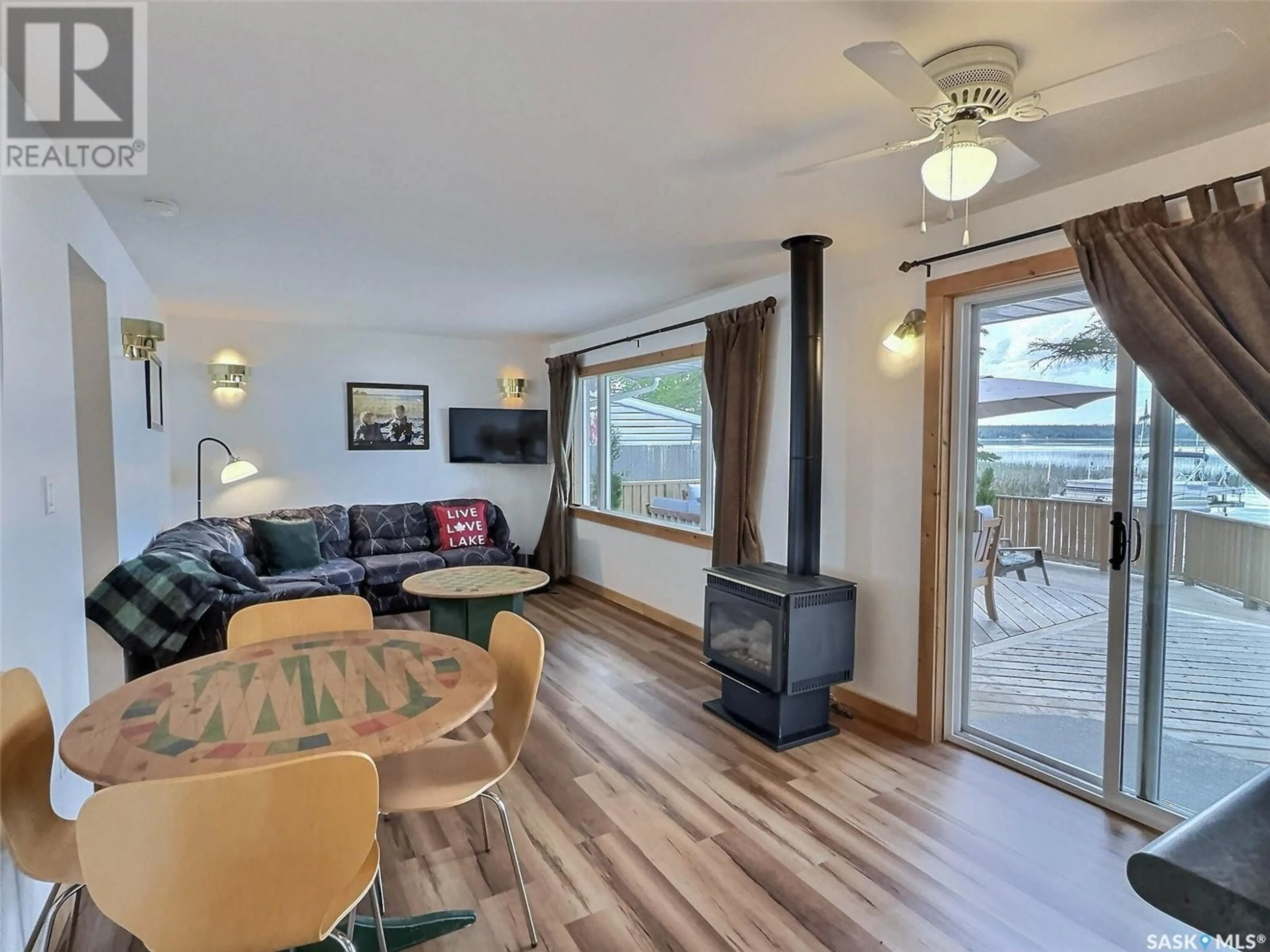Living room with furniture, wood/laminate floor for 312 FRONT STREET, Lakeland Rm No. 521 Saskatchewan S0J0N0