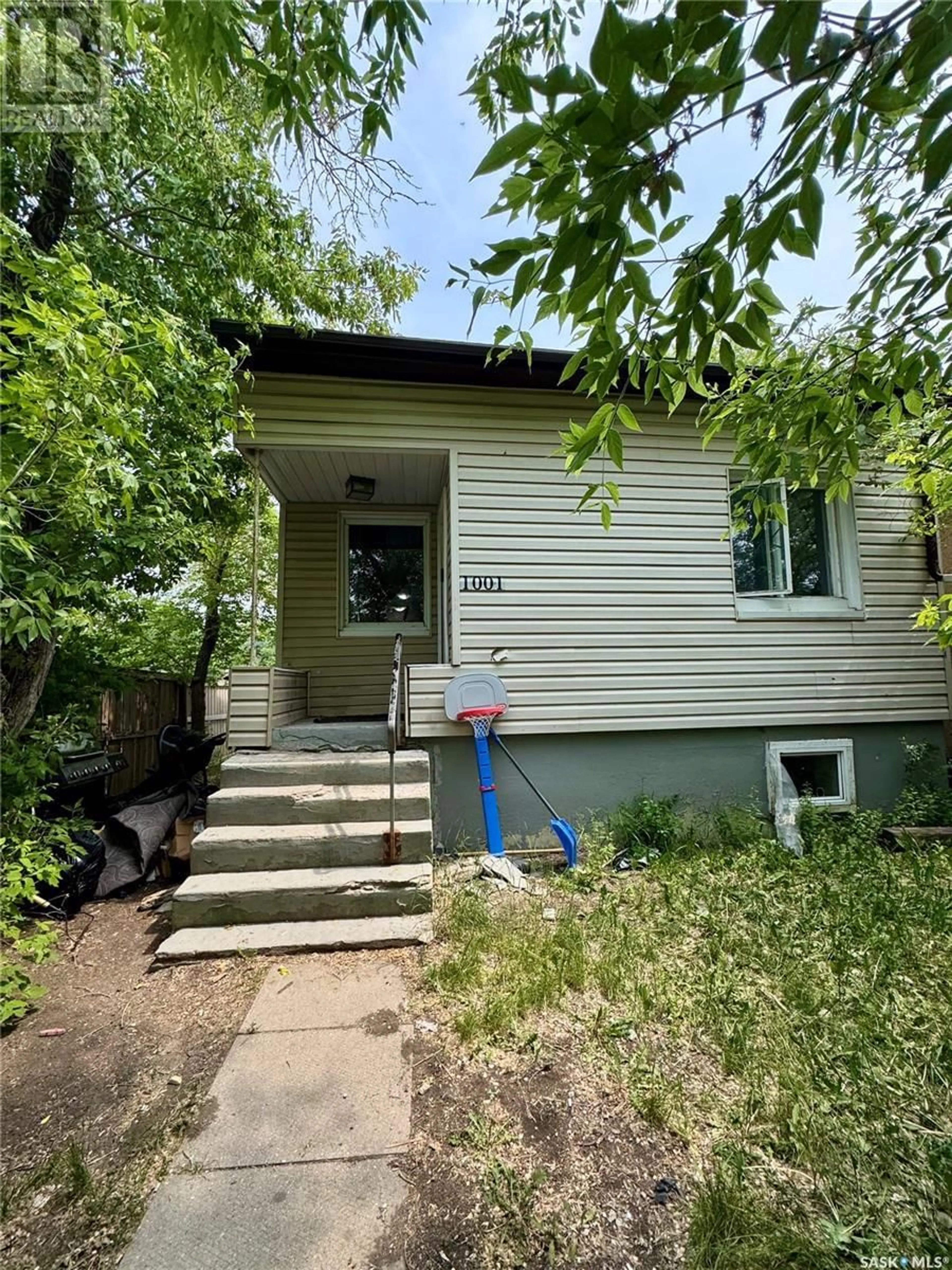 Home with vinyl exterior material, street for 1001 ROBINSON STREET, Regina Saskatchewan S4T2M8