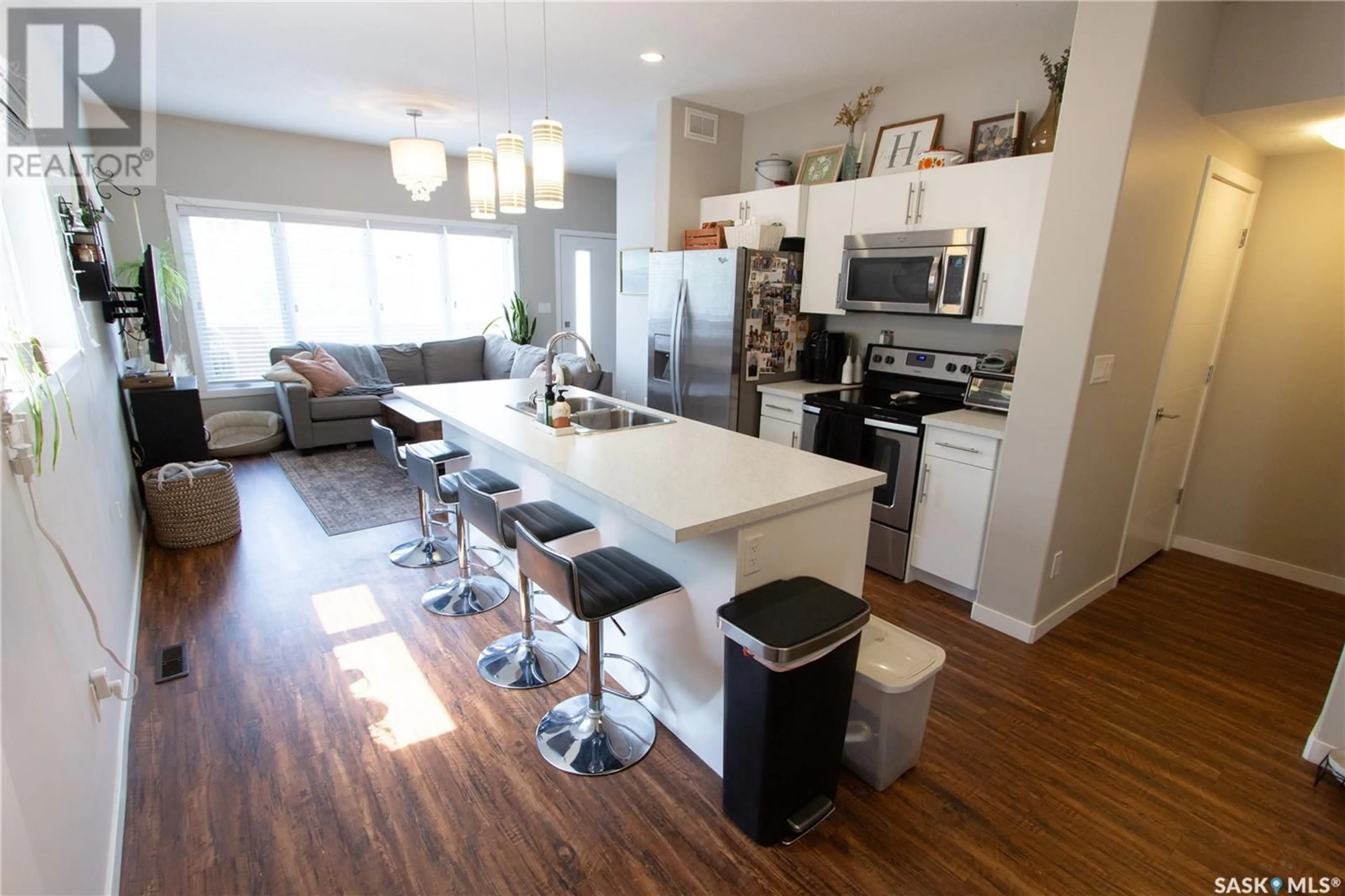 Open concept kitchen, wood/laminate floor for 3913 JAMES HILL ROAD, Regina Saskatchewan S4W0N8