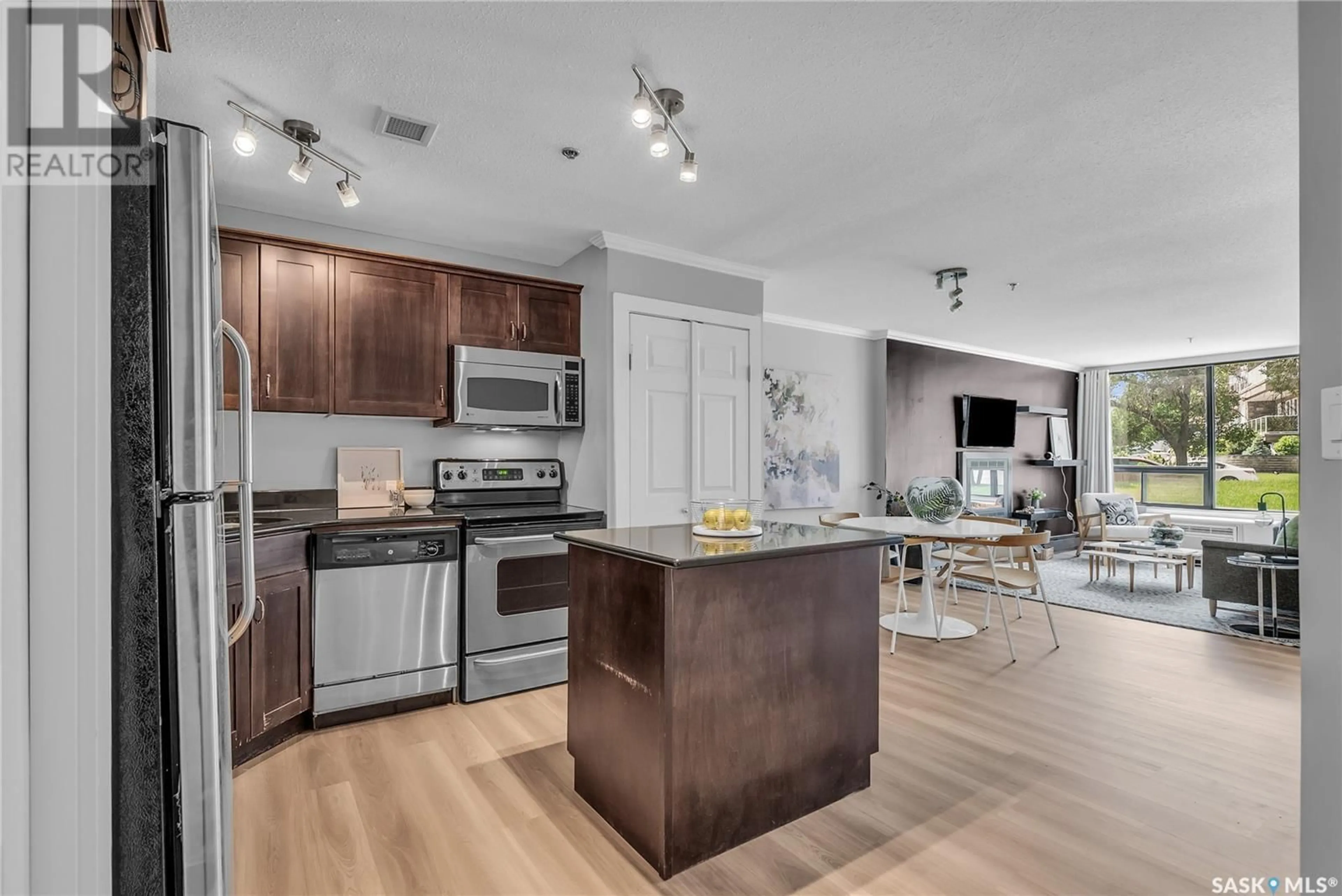 Open concept kitchen, wood/laminate floor for 106A 351 SAGUENAY DRIVE, Saskatoon Saskatchewan S7K5T4